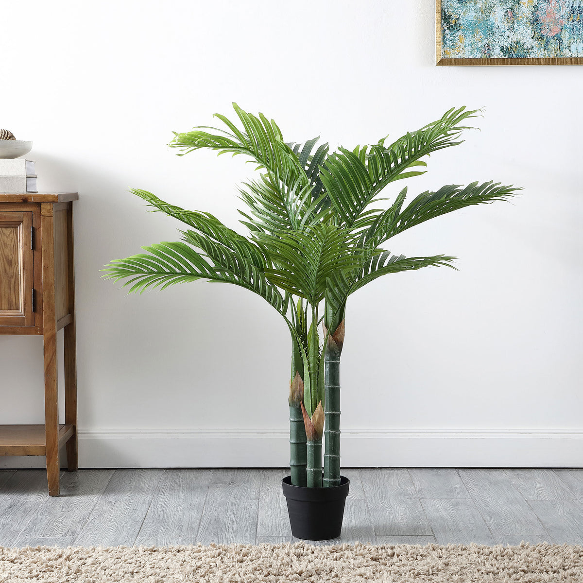 A graceful palm adds airy green foliage to a bright living room. || FXP2006A || front_room