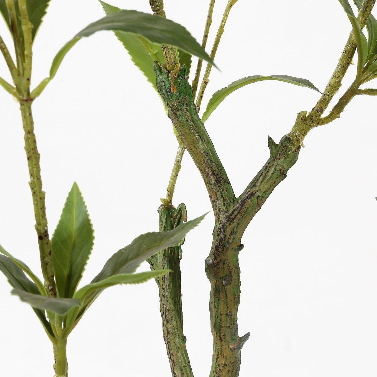 Textured branching stems give the faux plant a natural look.