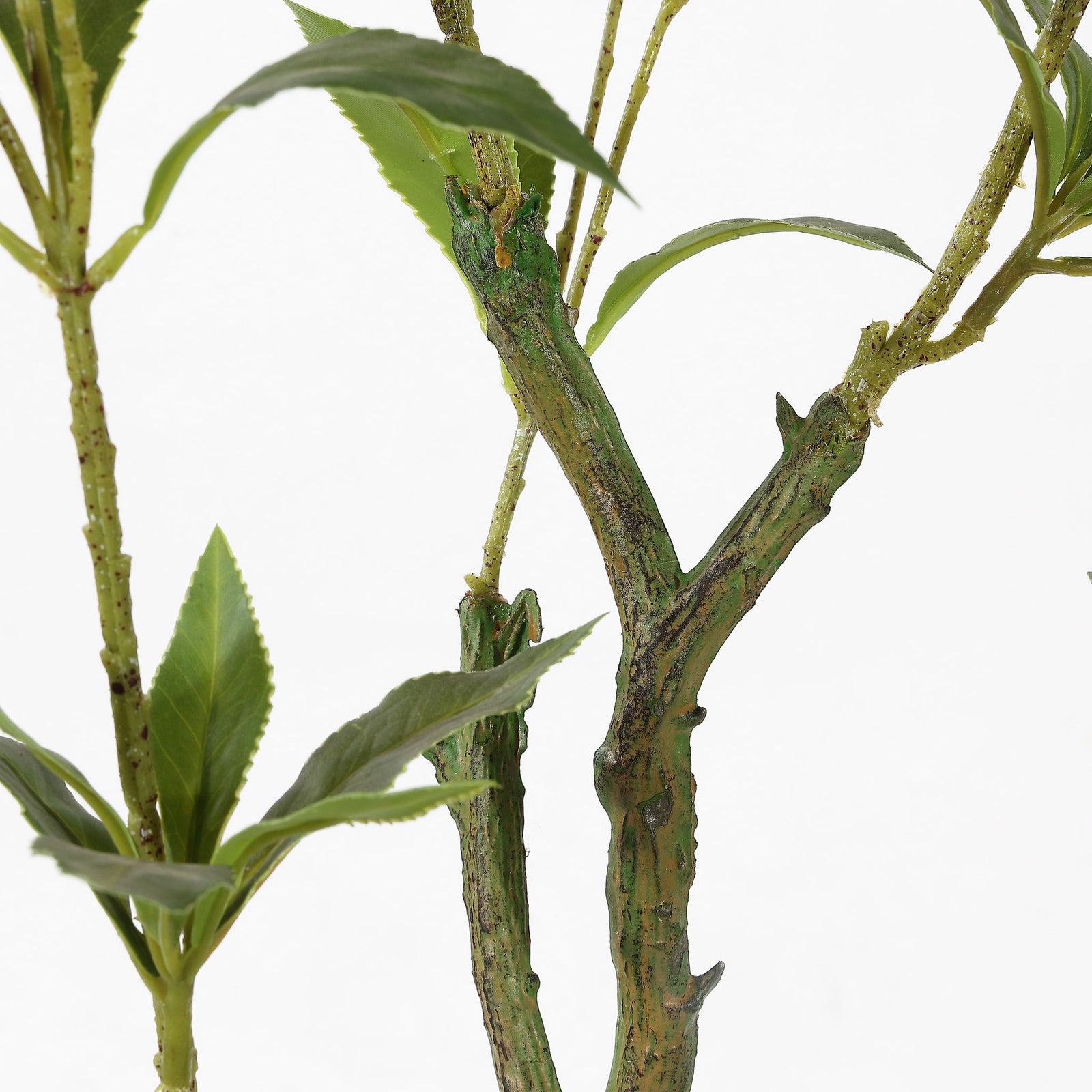 Textured branching stems give the faux plant a natural look. || FXP2012A || detail_studio