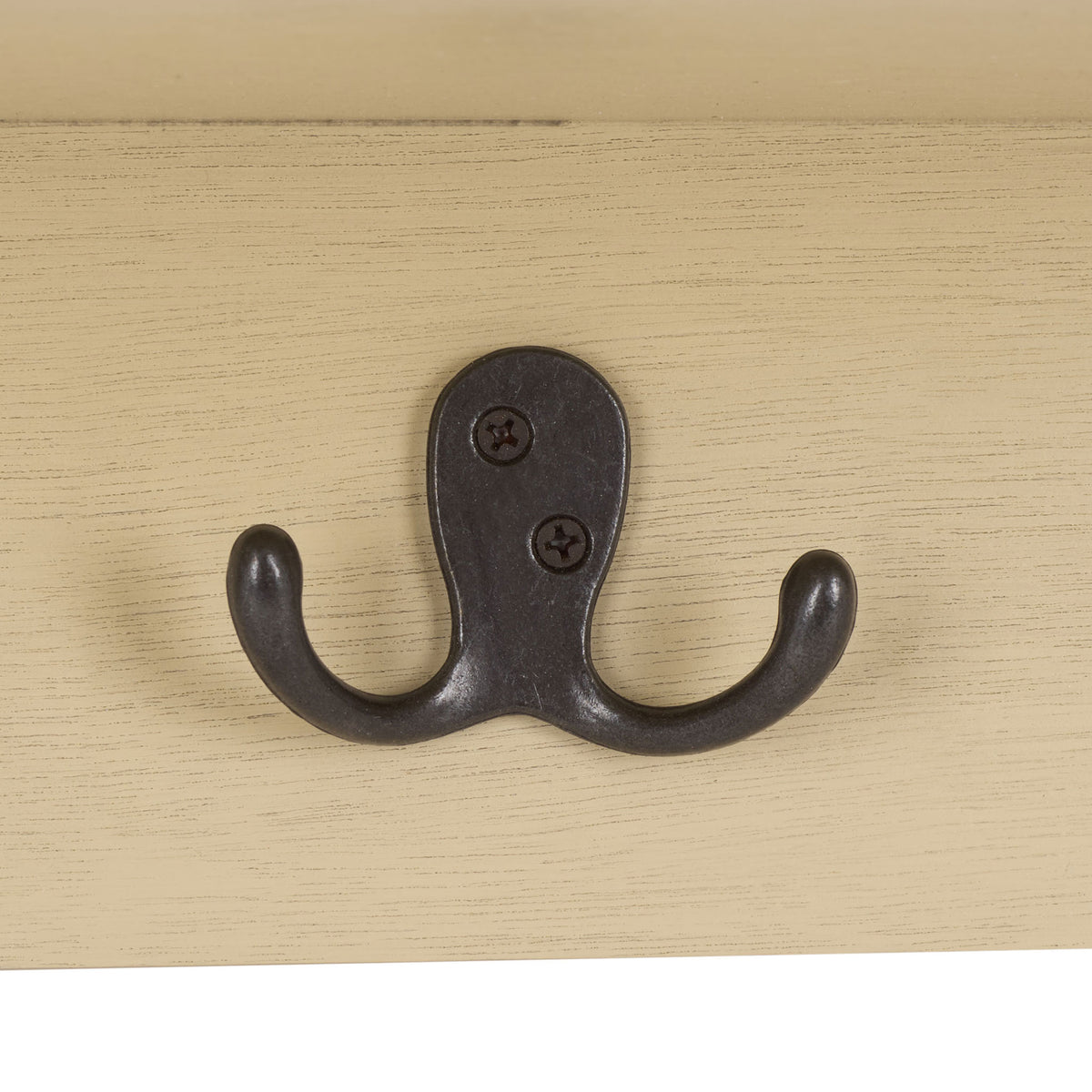 A dark metal double hook stands out against the warm sand finish for hanging daily essentials || HAC5700E || detail_studio