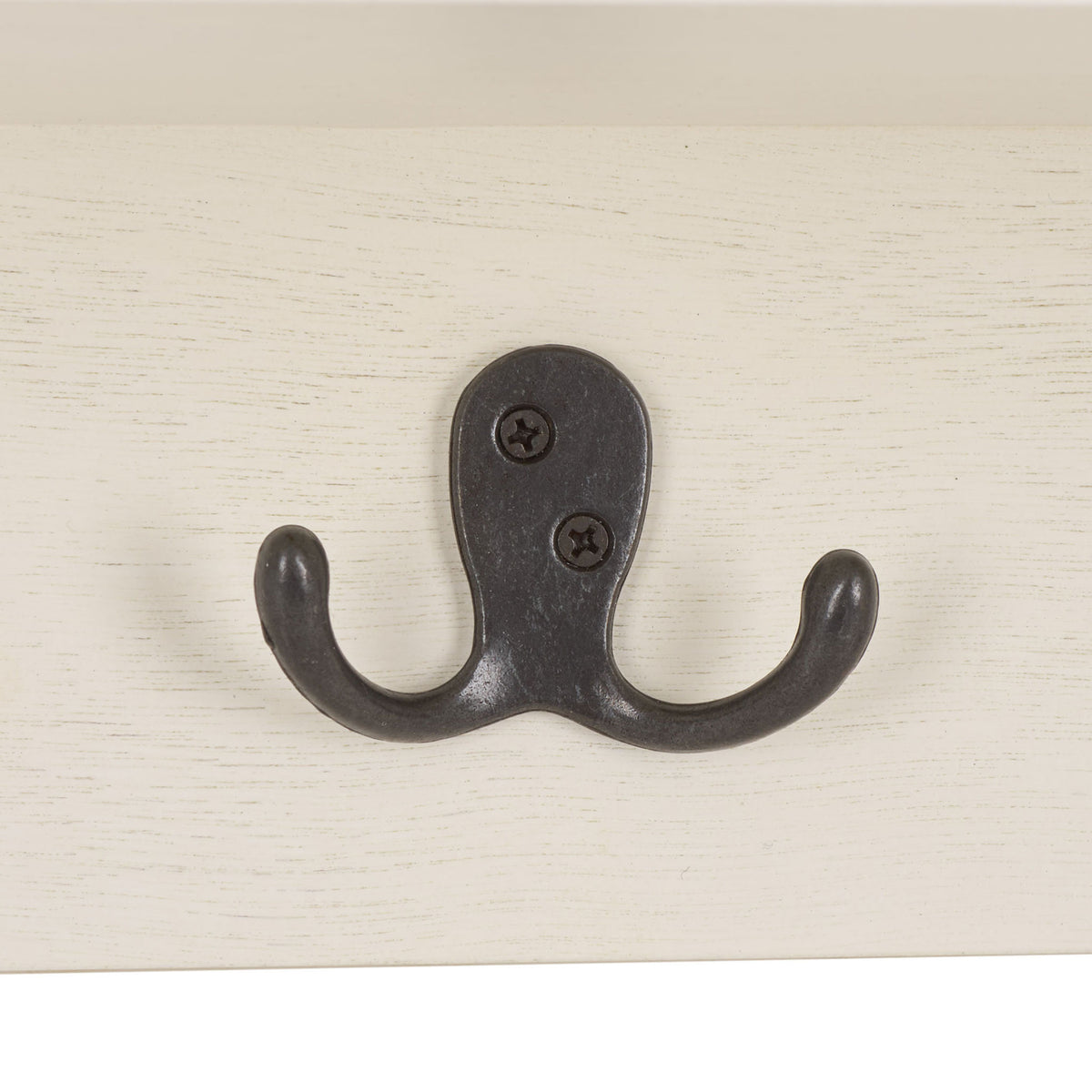 A dark metal double hook brings contrast and convenient hanging space to the ivory rack || HAC5700H || detail_studio