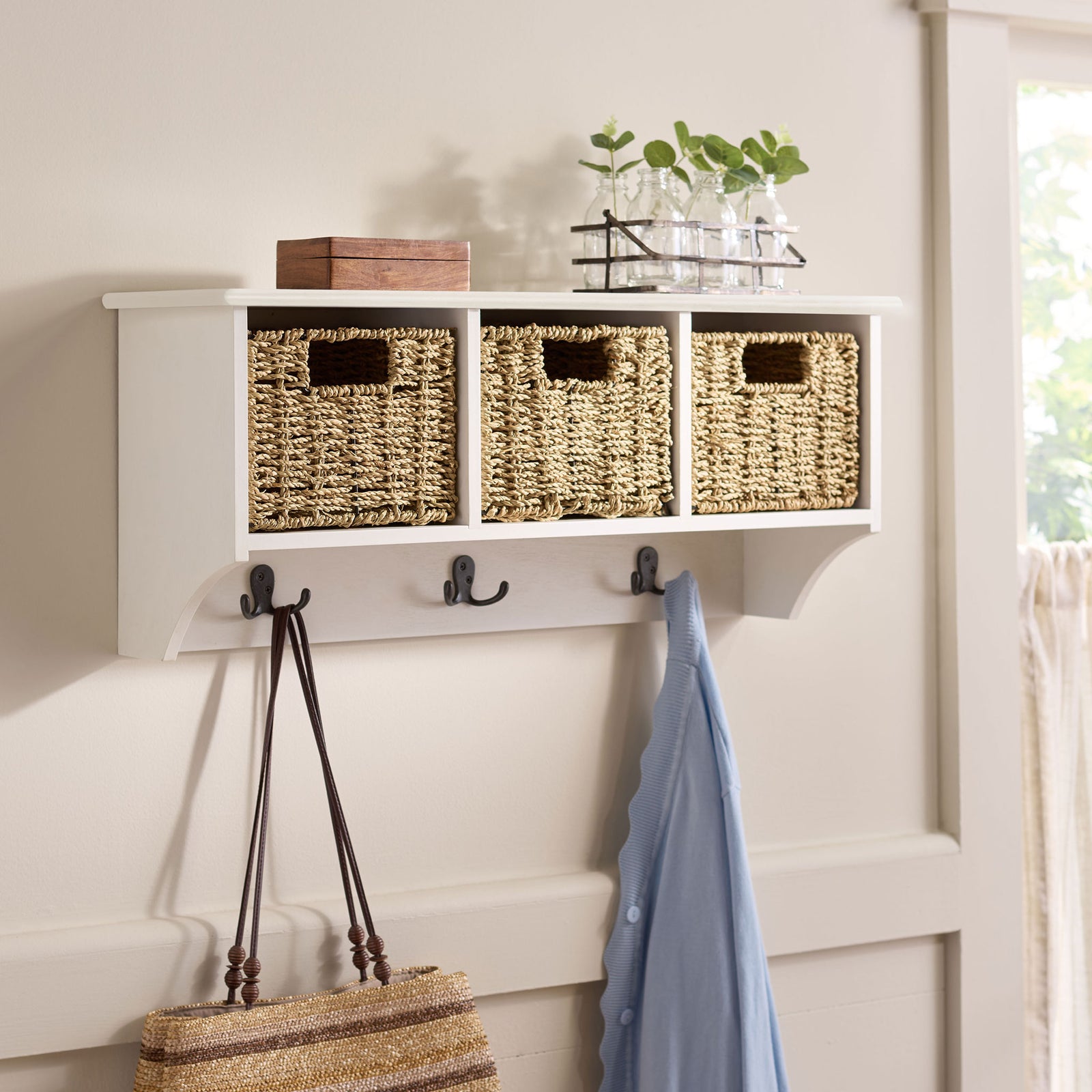 Ivory wall storage organizes baskets and outerwear while leaving room for decor on top || HAC5700H || front_angle_room