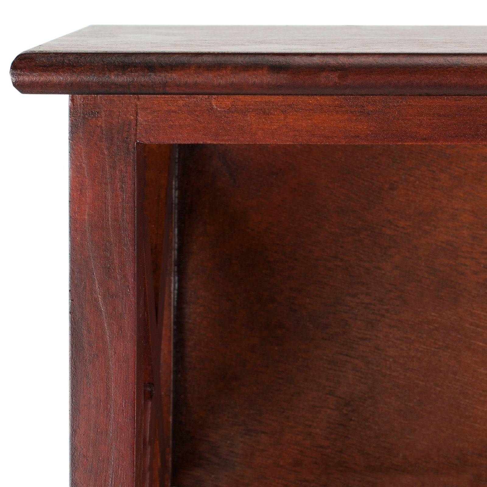 Rounded top trim showcases cherry-toned wood grain around an open cubby. || HAC5703A || detail_studio