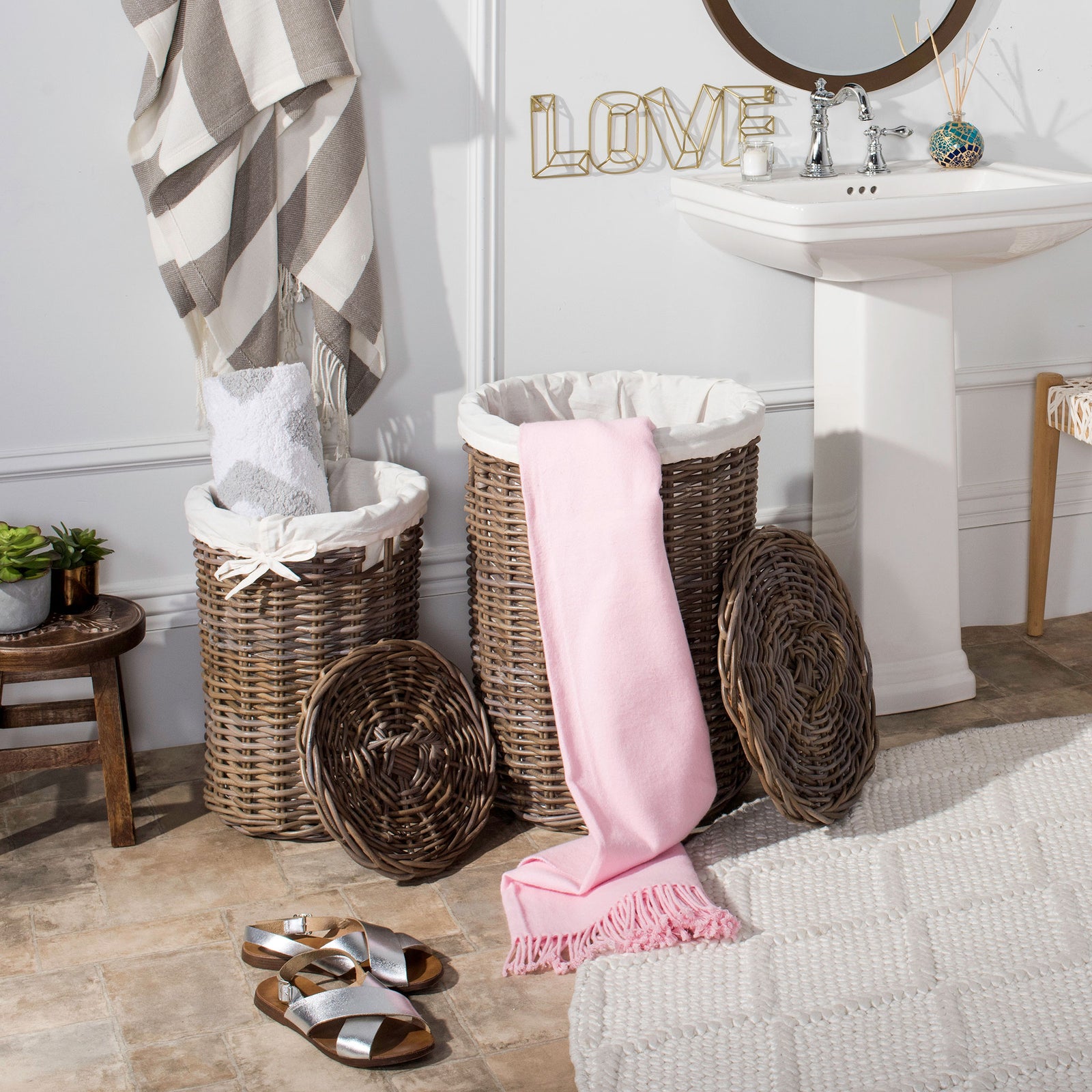 Two open rattan hampers offer white fabric liners and coordinating woven lids for laundry storage. || HAC6001A || front_open_room