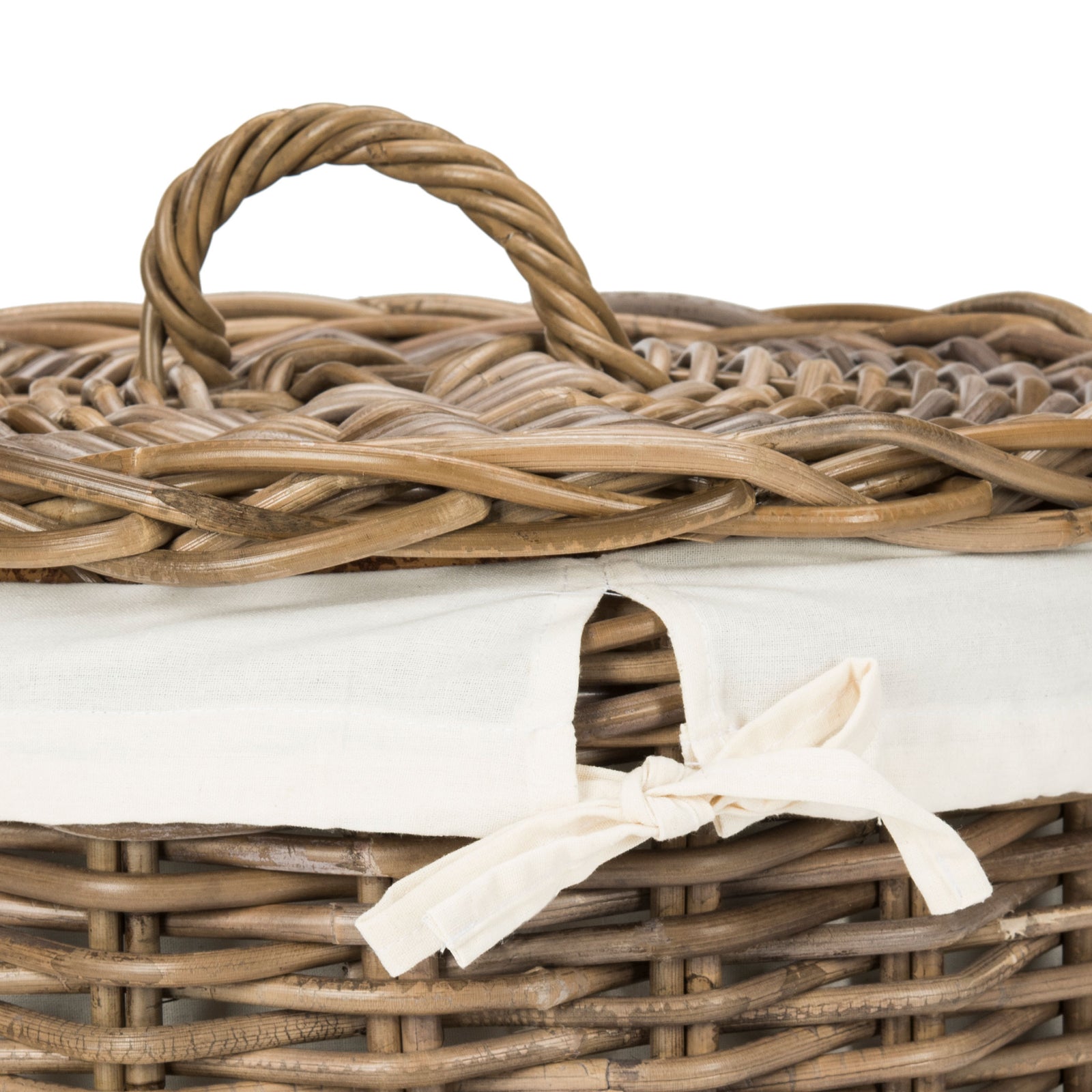 A white cotton bow secures the liner beneath a woven lid with a twisted rattan handle. || HAC6001A || detail_studio