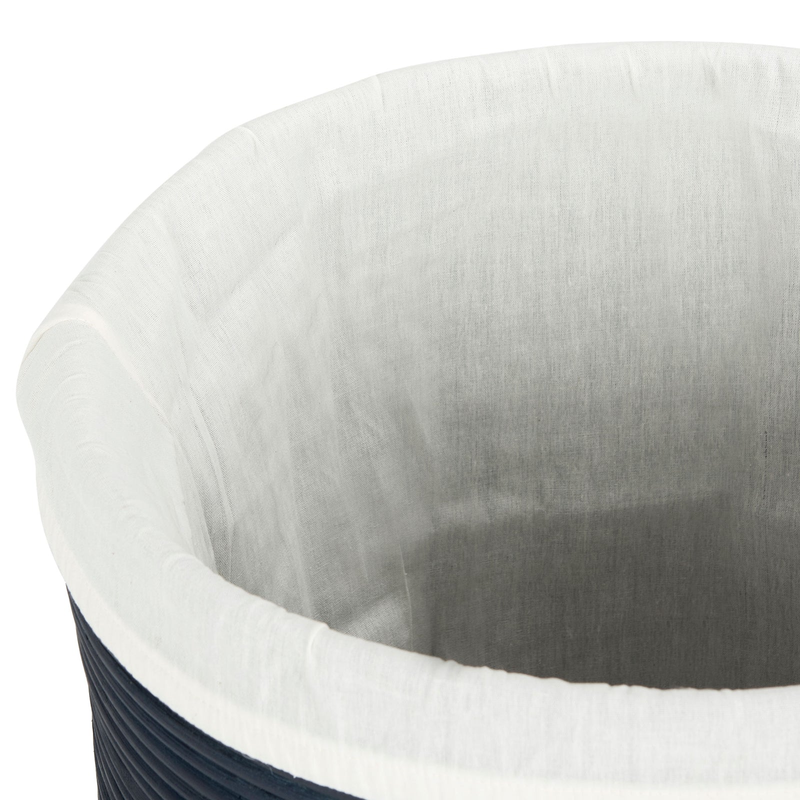 A white fabric liner wraps over the rim of the navy rattan hamper || HAC6501B || storage_open_studio