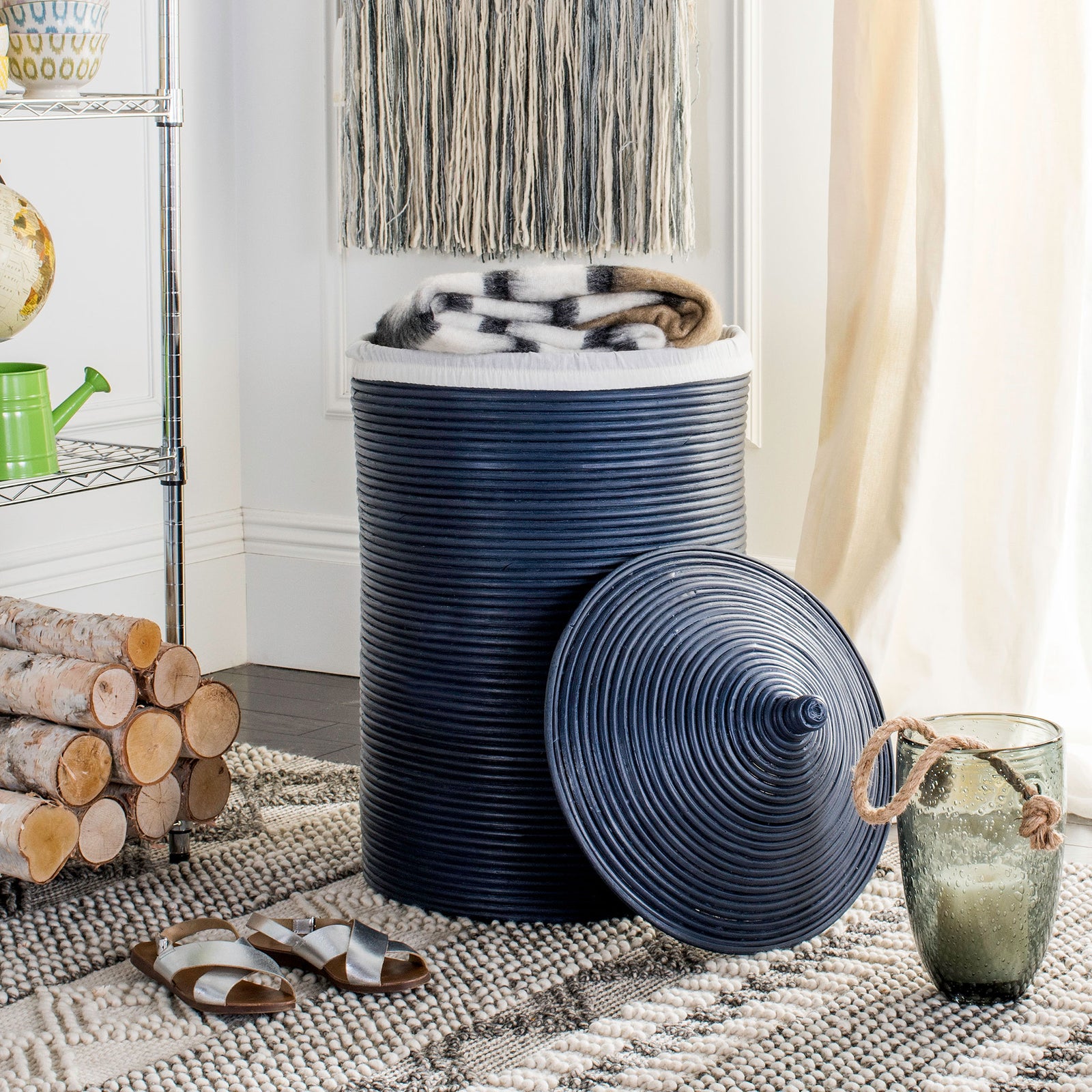 Navy rattan hamper holds folded blankets while its matching woven lid rests nearby || HAC6501B || front_open_room