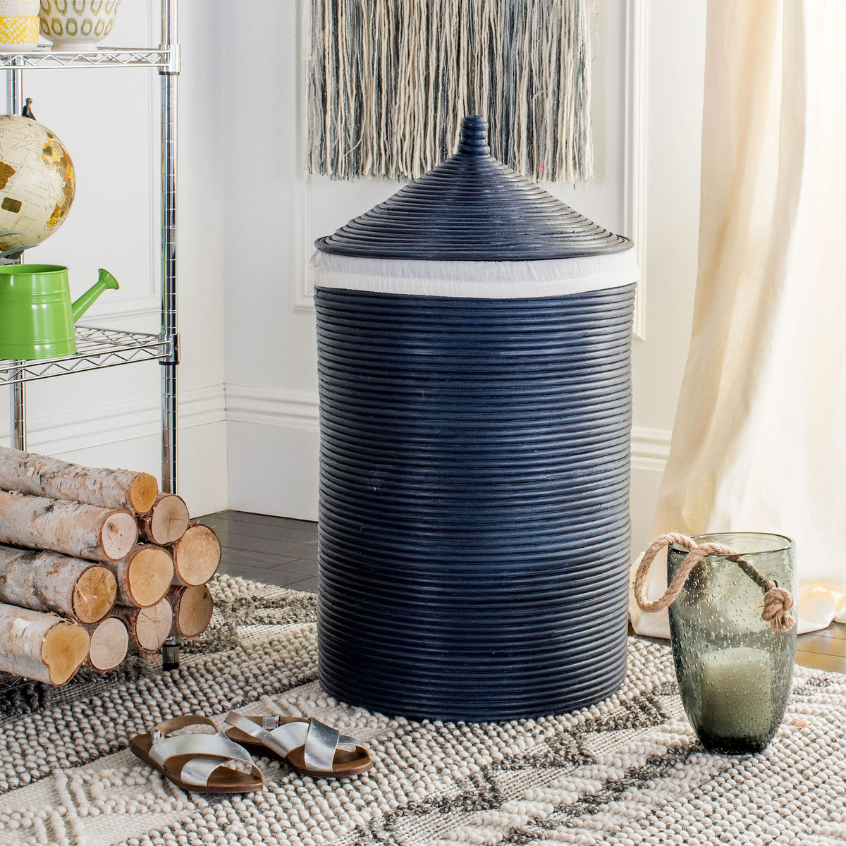 Lidded navy rattan hamper adds rich woven texture and hidden storage to a cozy room || HAC6501B || front_room
