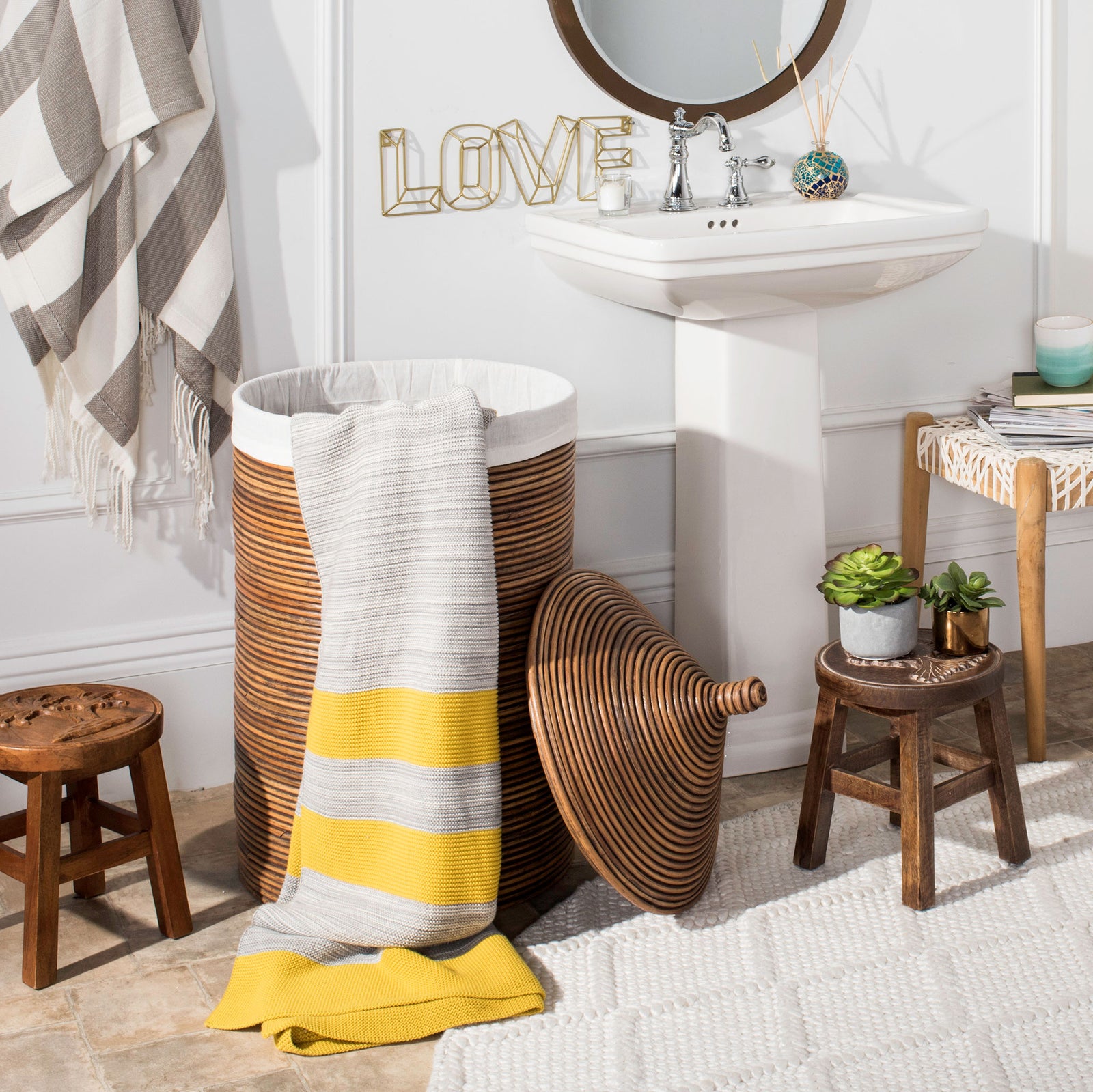 Honey-brown rattan hamper keeps laundry within reach beside its removable woven lid || HAC6501C || front_open_room