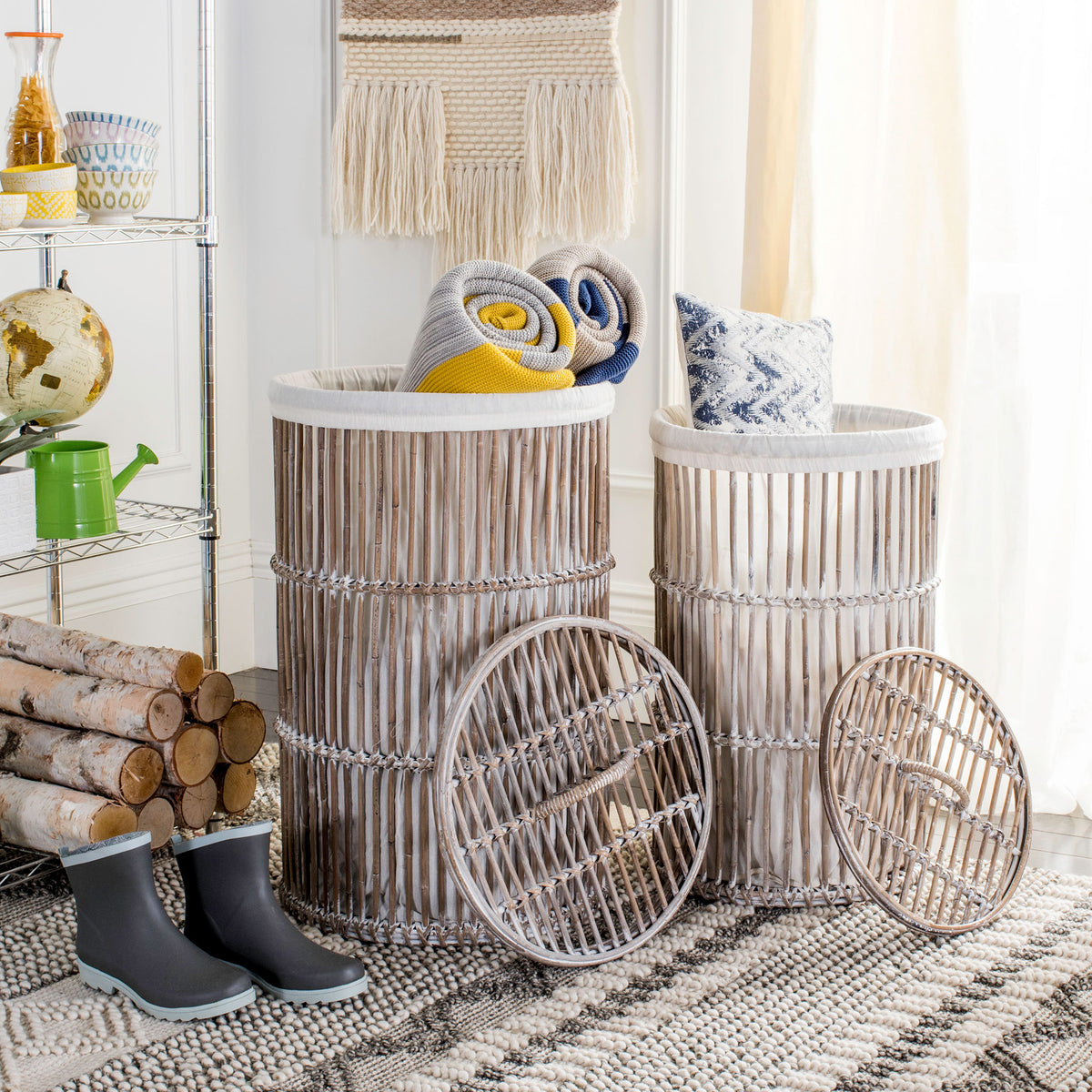 Two whitewashed rattan hampers hold rolled blankets and a pillow beneath removable woven lids || HAC6502A || front_open_room