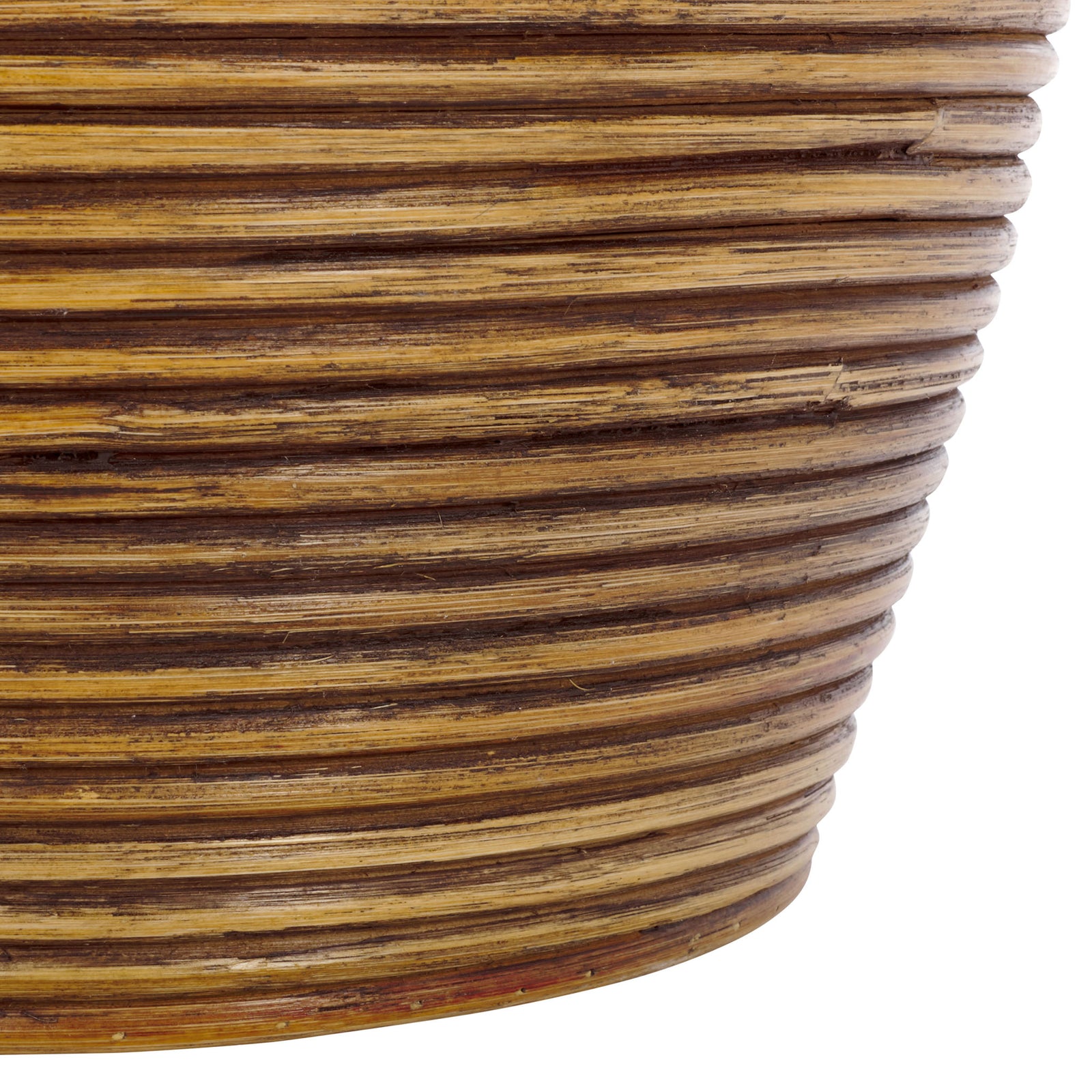 Layered rattan coils wrap the rounded basket base in warm honey-brown tones || HAC6503A || detail_studio