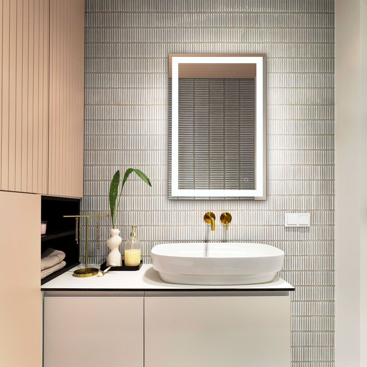Bright perimeter lighting gives the slim silver mirror a soft glow above a white vanity || LMR1000A || front_on_room