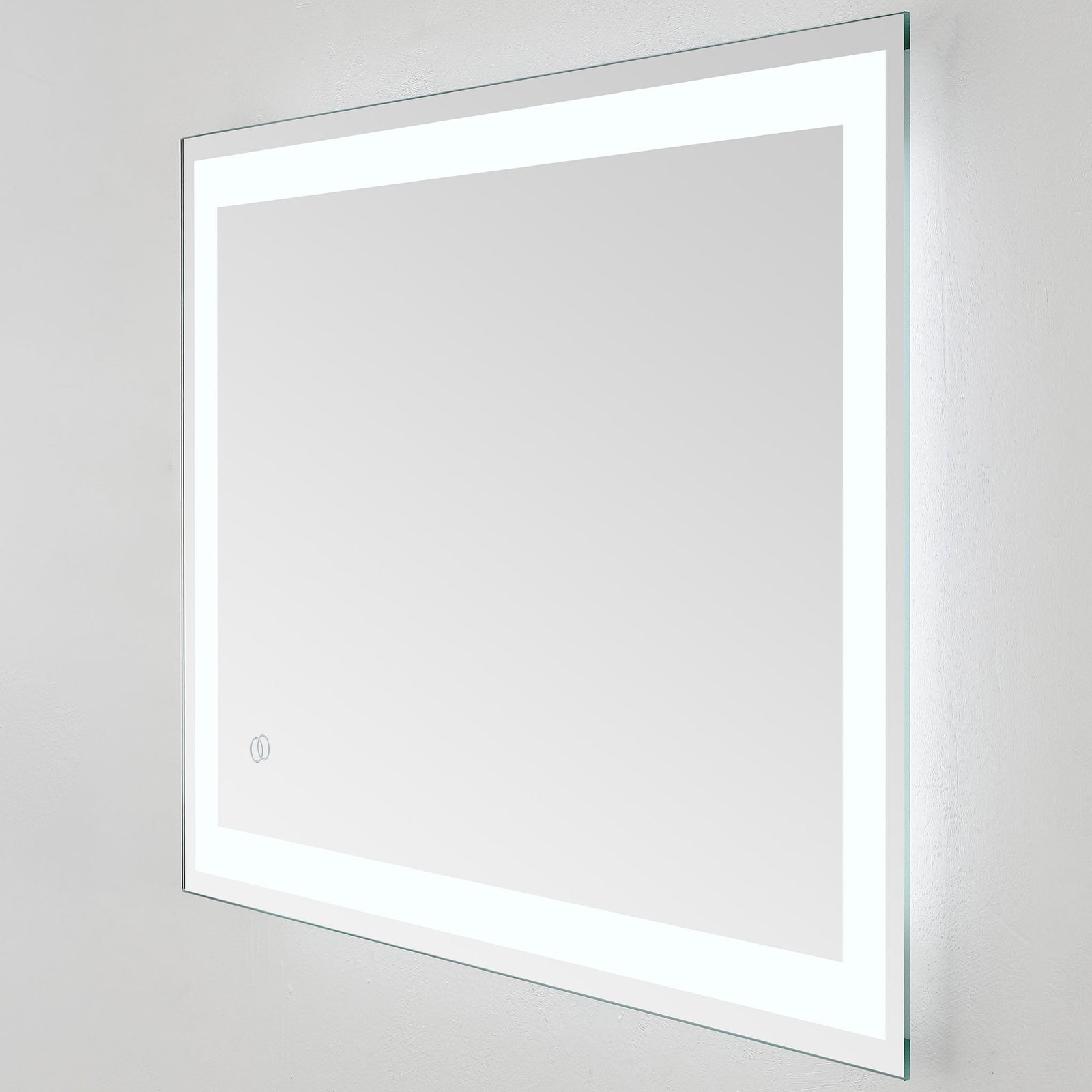 A bright white LED border illuminates the wide mirror's clean lines and sleek silver edge || LMR1000A || front_angle_on_studio