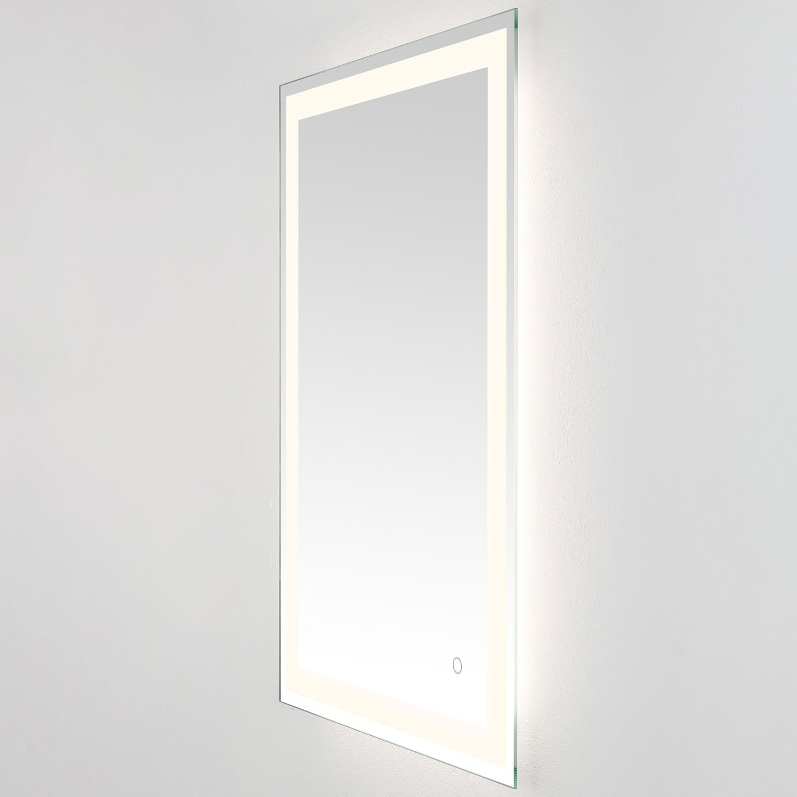 A gentle white glow surrounds the tall mirror, balanced by a sleek silver edge || LMR1000A || front_angle_on_studio