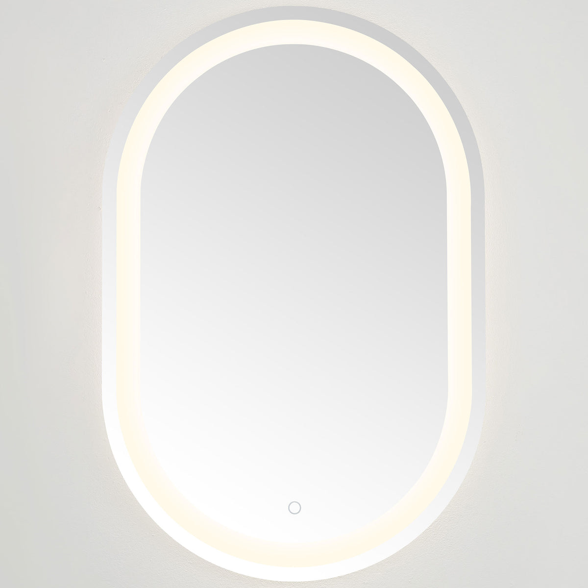 Soft white illumination frames the smooth mirror glass and gently arched ends || LMR1002A || front_on_studio