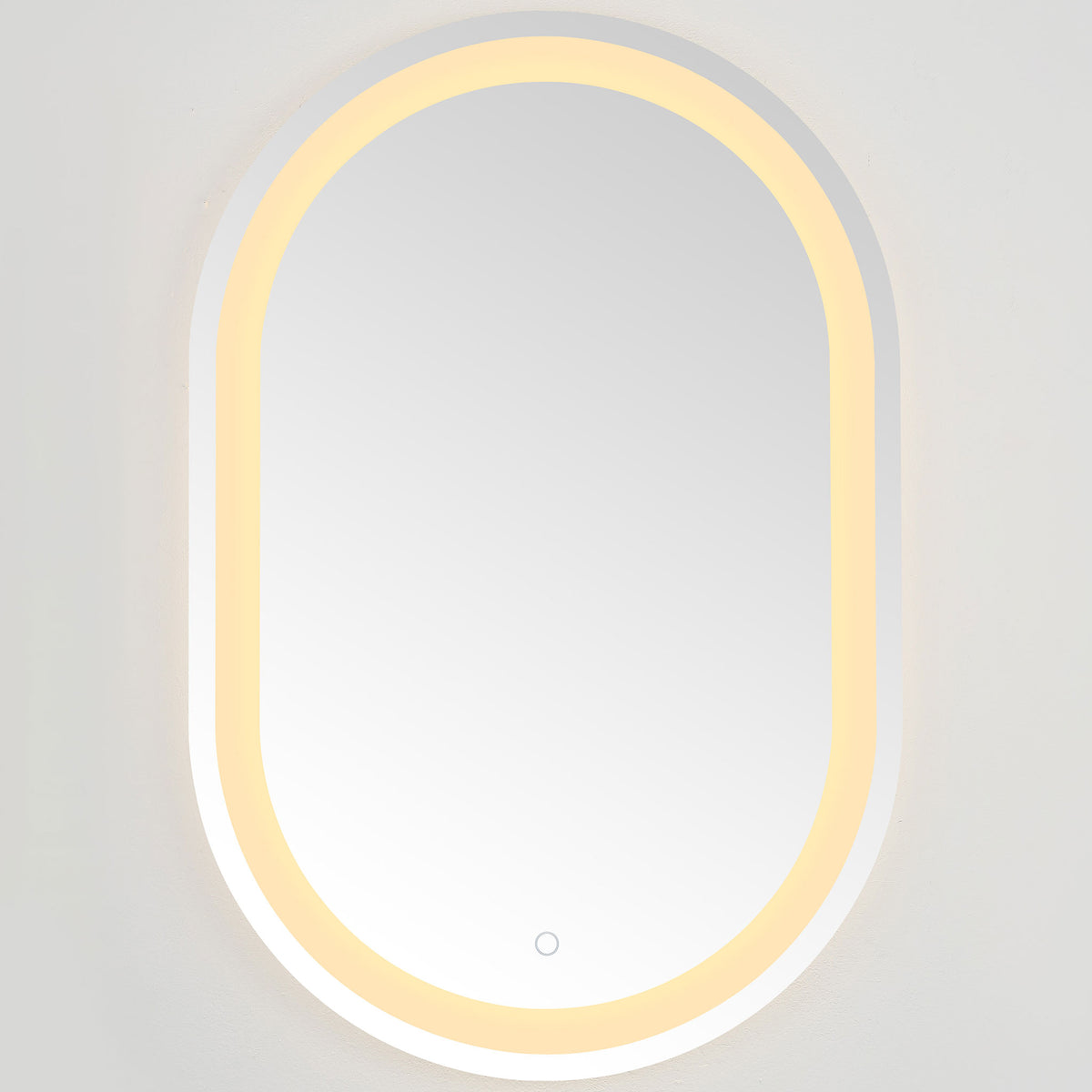 Warm amber LEDs trace the rounded mirror, adding an inviting glow to its silver finish || LMR1002A || front_on_studio