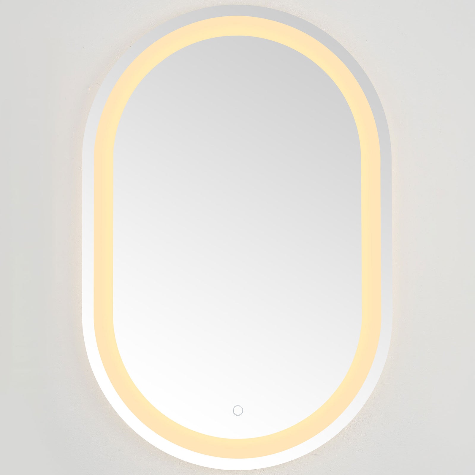 Warm amber LEDs trace the rounded mirror, adding an inviting glow to its silver finish || LMR1002A || front_on_studio