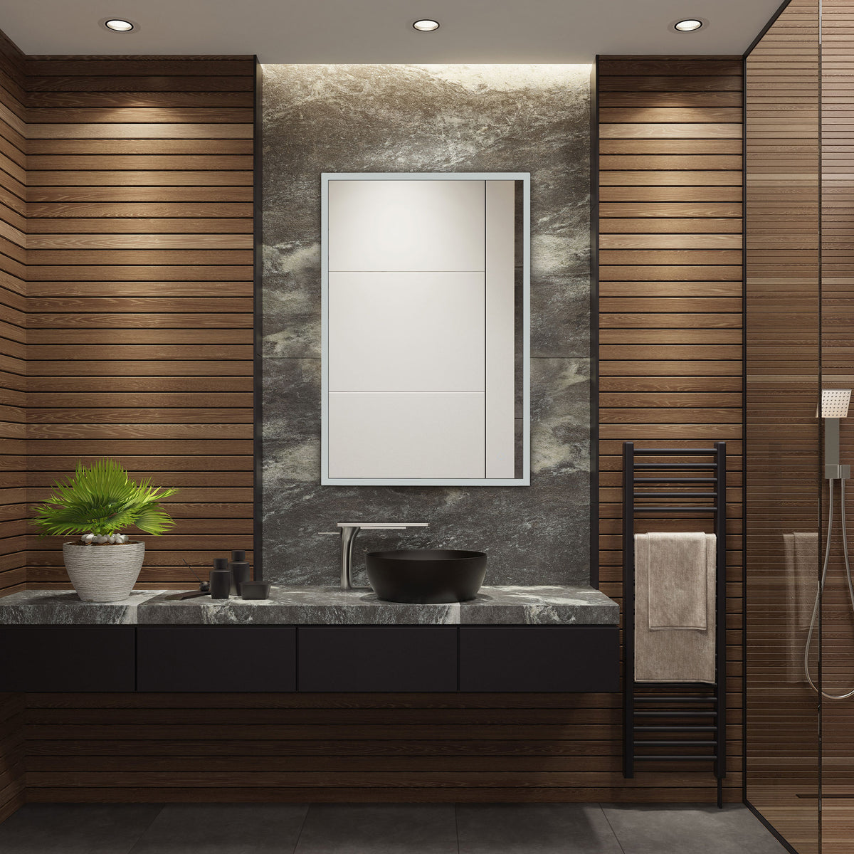 A slim silver-framed mirror adds clean lines above a stone vanity and black vessel sink. || LMR1003A || front_room