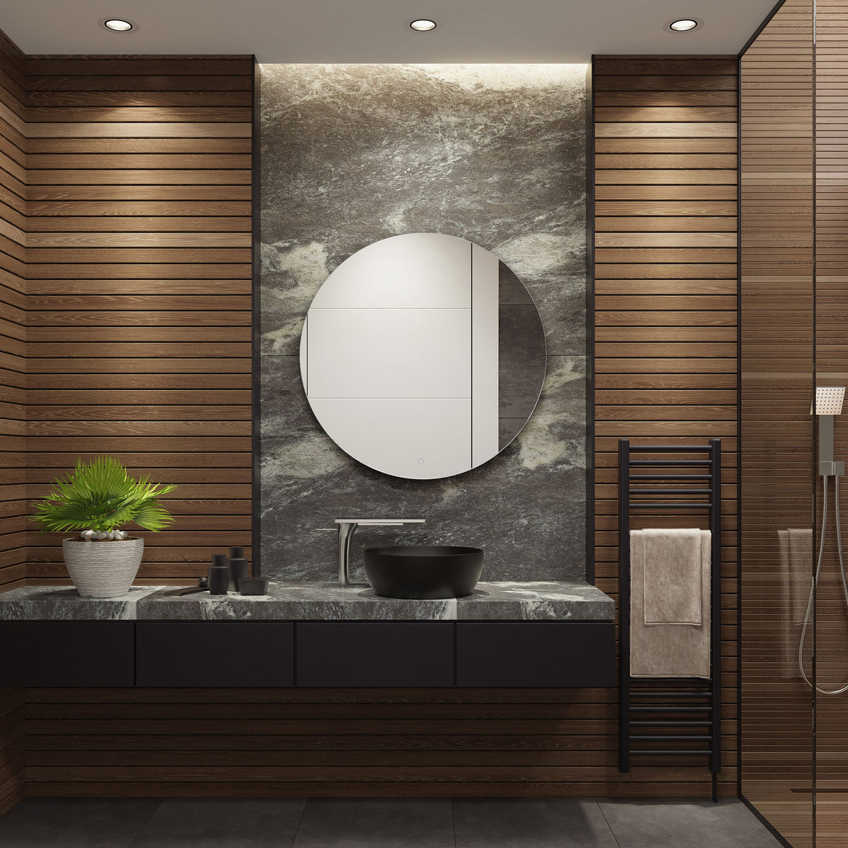 A sleek round mirror lends a minimalist touch to a bathroom with a dark stone vanity. || LMR1004A || front_room