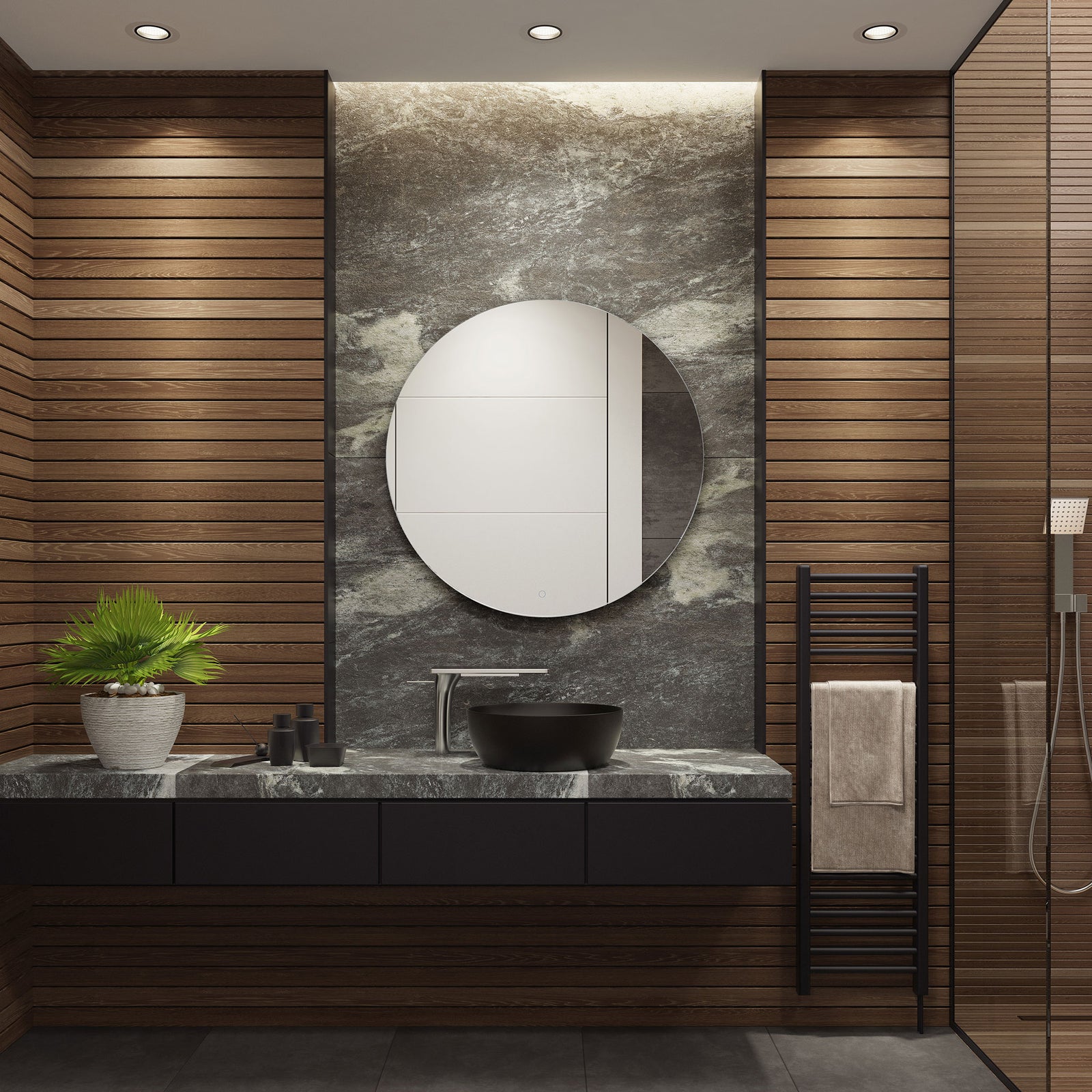 A sleek round mirror lends a minimalist touch to a bathroom with a dark stone vanity. || LMR1004A || front_room