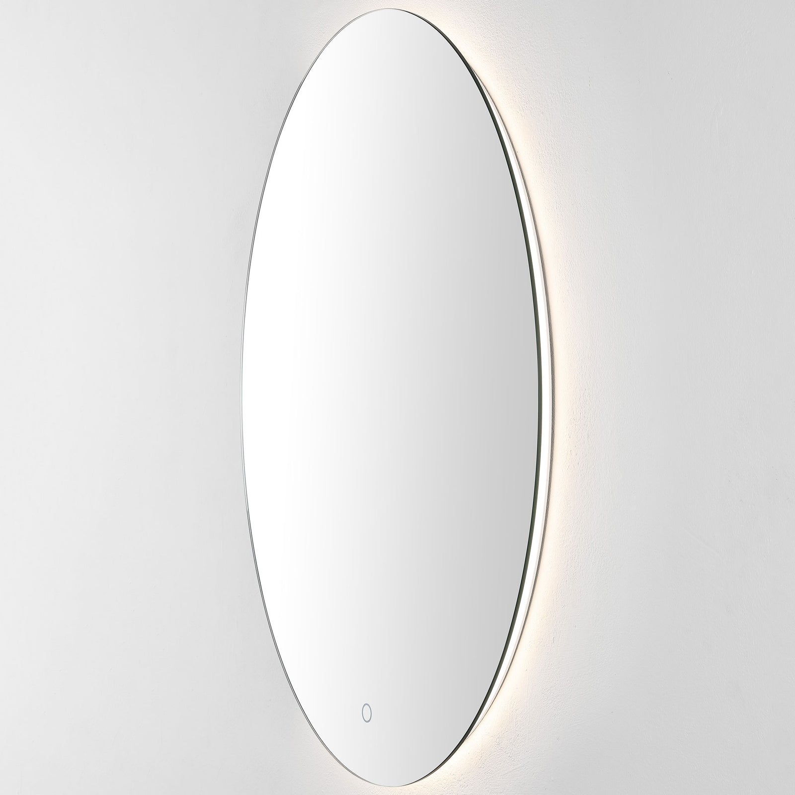 Warm-white backlighting gently illuminates the wall beyond the mirror's narrow edge || LMR1005A || front_angle_on_studio