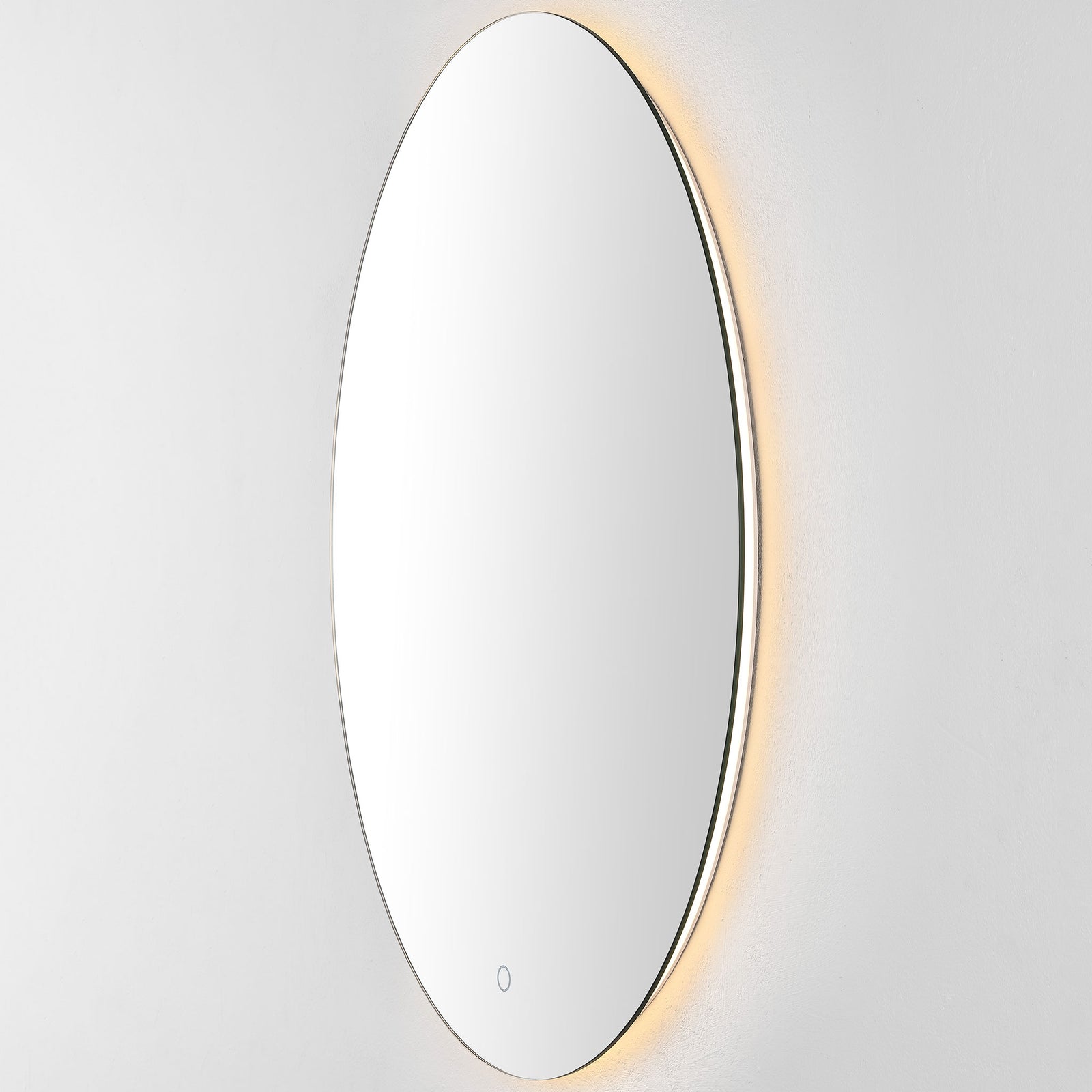 An amber-toned LED halo adds warmth to the mirror's sleek oval form || LMR1005A || front_angle_on_studio