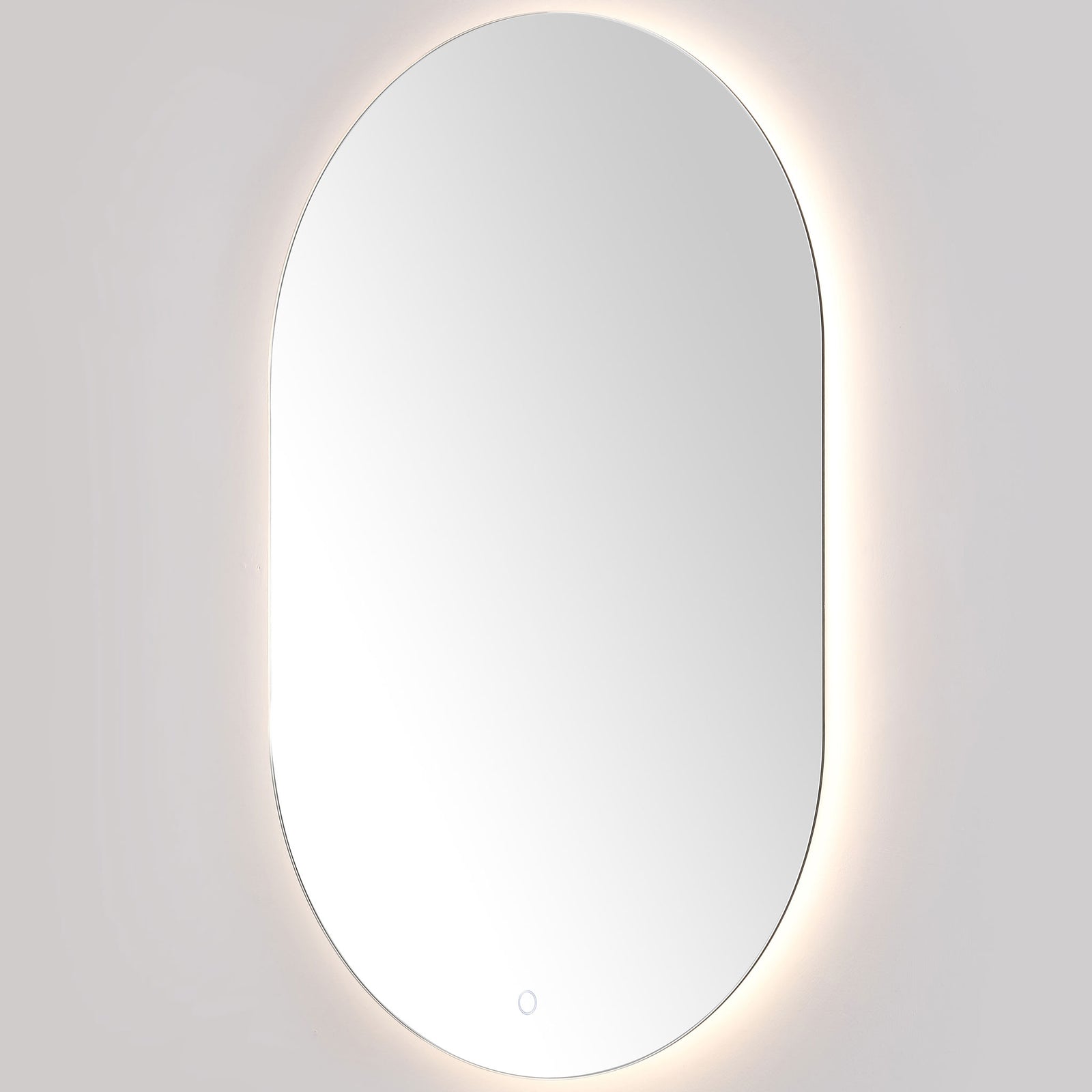 A softer white glow follows the mirror's rounded outline and discreet touch control. || LMR1007A || front_angle_on_studio