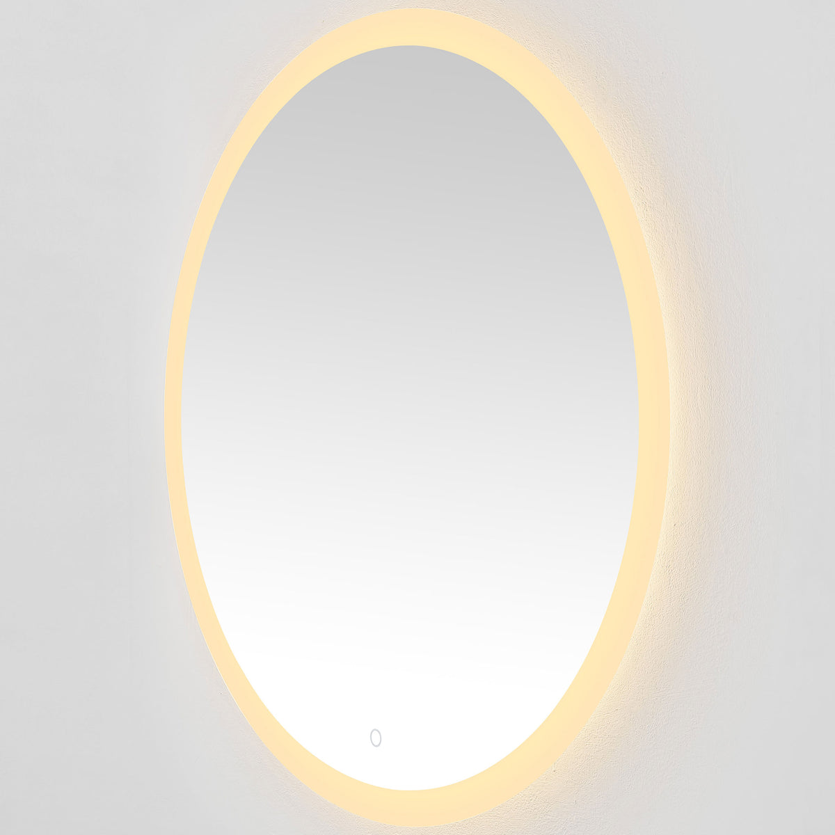 A golden LED ring brings a cozy glow to the round mirror and surrounding wall. || LMR1008A || front_angle_on_studio
