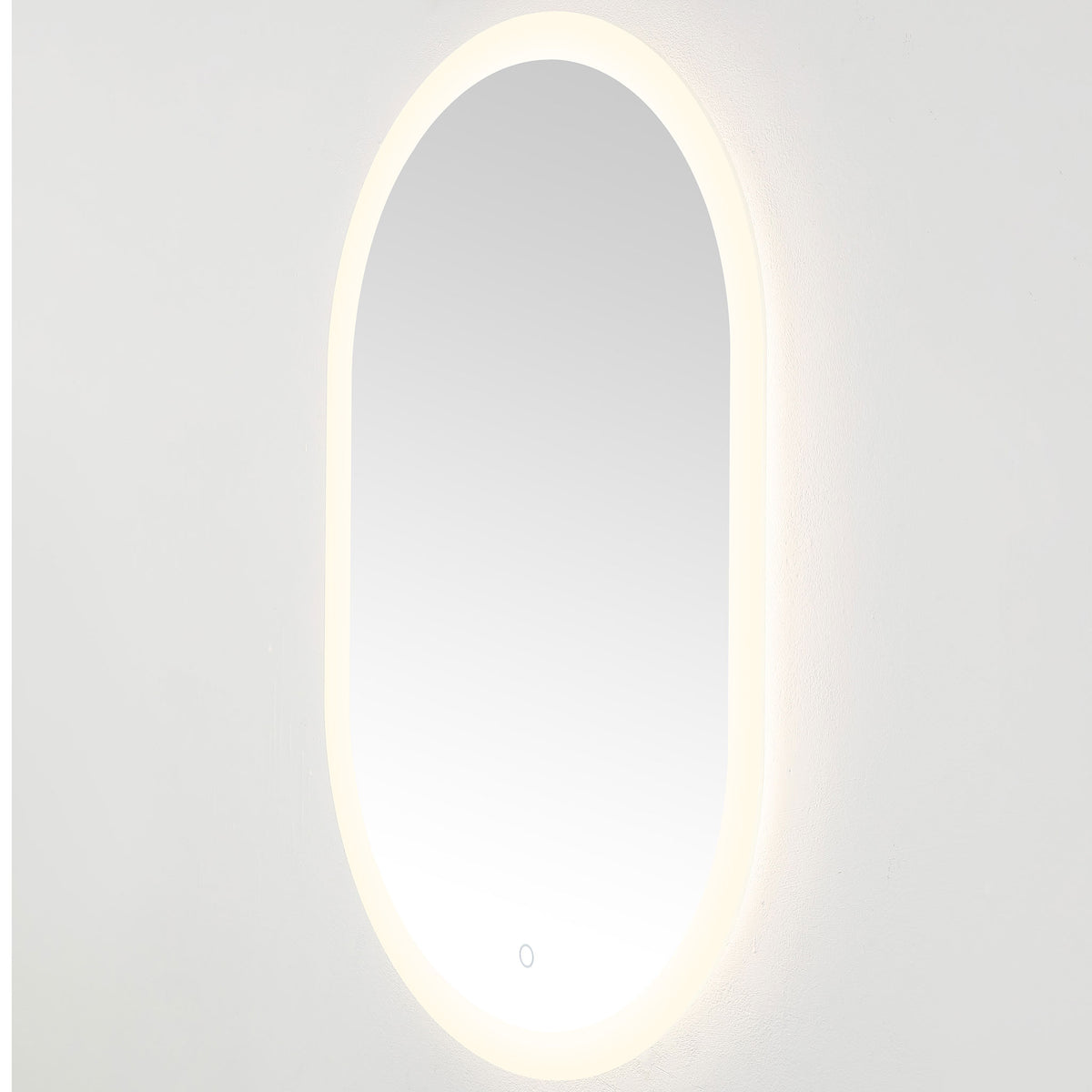Soft white LEDs illuminate the rounded mirror and cast a subtle glow against the wall || LMR1009A || front_angle_on_studio
