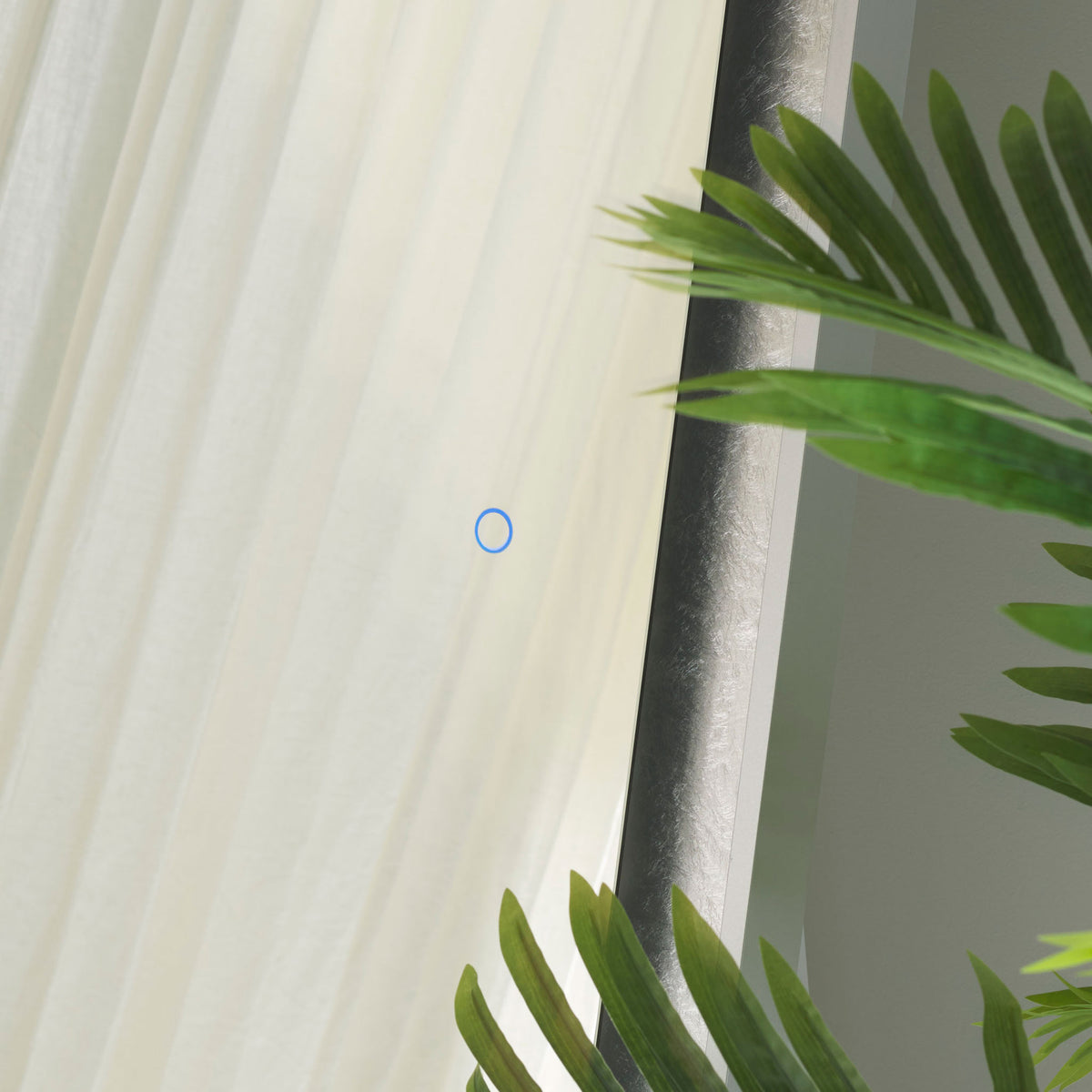 A blue touch control sits on the glass beside shimmering silver leaf trim and a slim silver-gray frame. || LMR1015A || detail_room