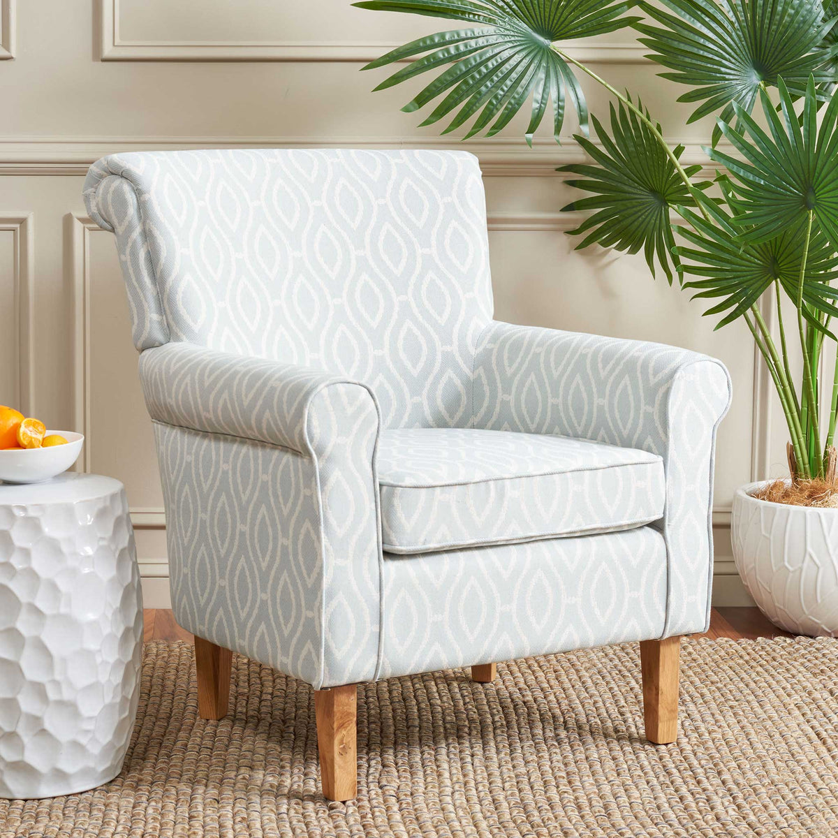 Versatile club chair in light blue trellis adds relaxed elegance with its roll arms and cushioned seat || MCR1002G || front_angle_room