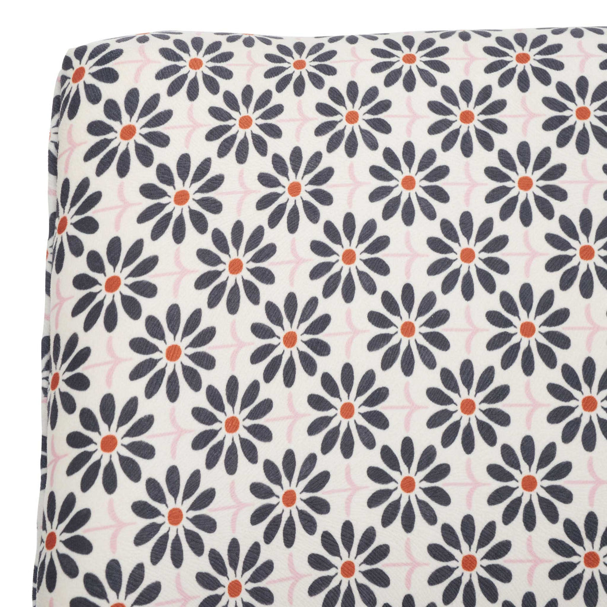 Soft viscose-blend fabric with black floral motif and warm orange centers on a cream ground