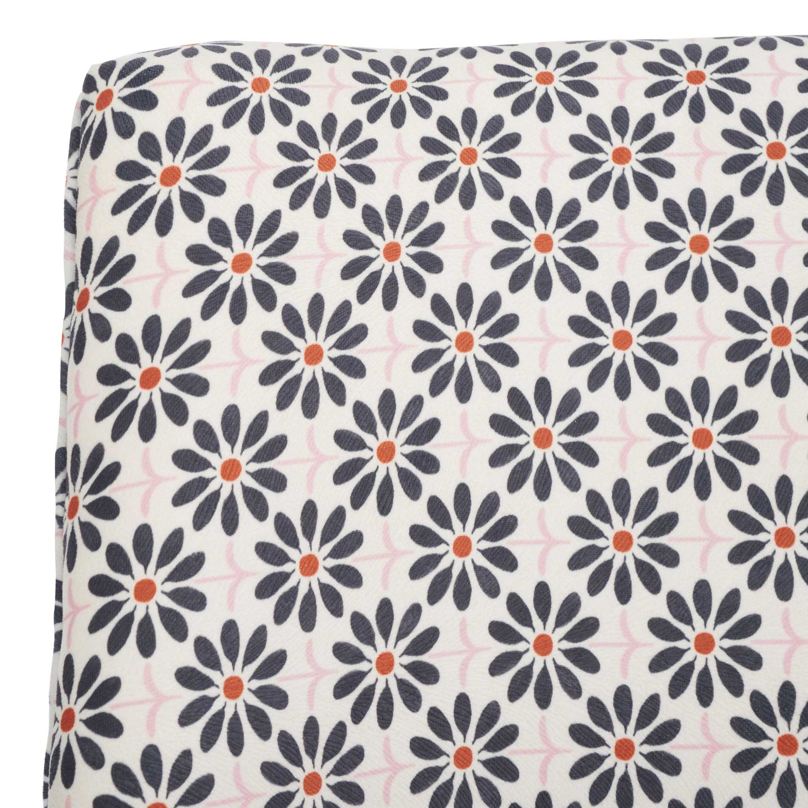 Soft viscose-blend fabric with black floral motif and warm orange centers on a cream ground || MCR1028D || detail_studio