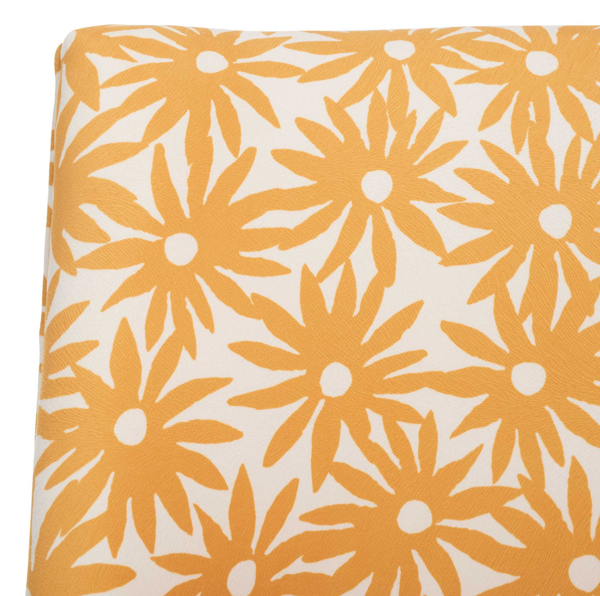 Smooth upholstery in vibrant yellow floral on cream for a lively, modern look.