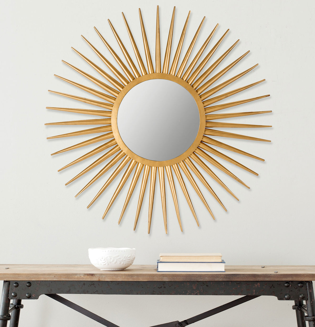 Gold sunburst mirror makes a striking wall accent with its radiant metal frame || MIR4000A || front_room