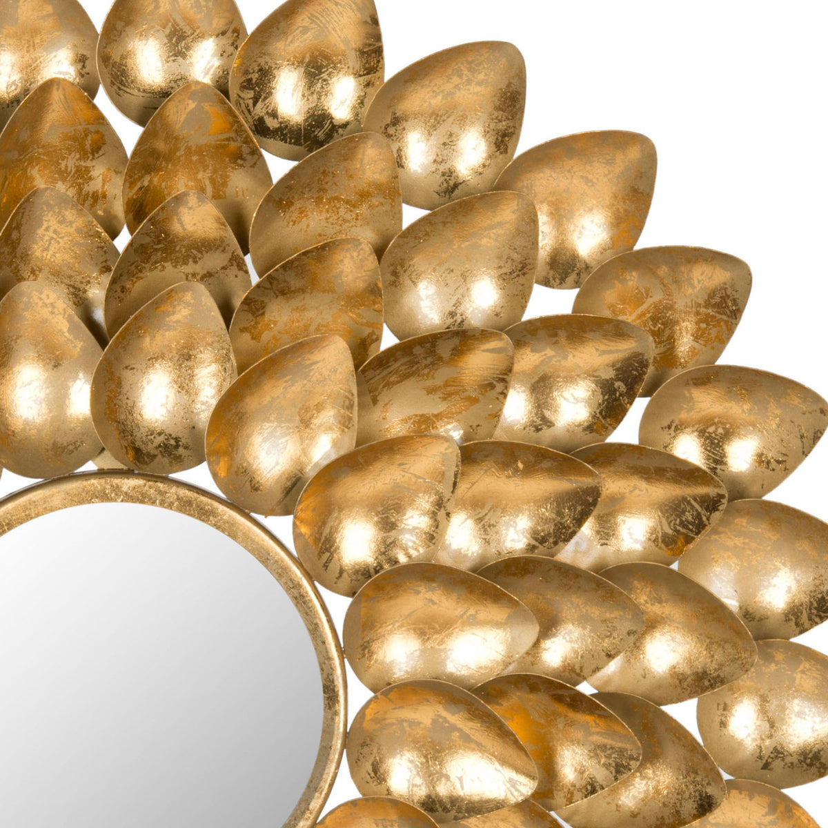 Textured antique gold metal leaves layer around the circular mirror for a rich, sculptural finish