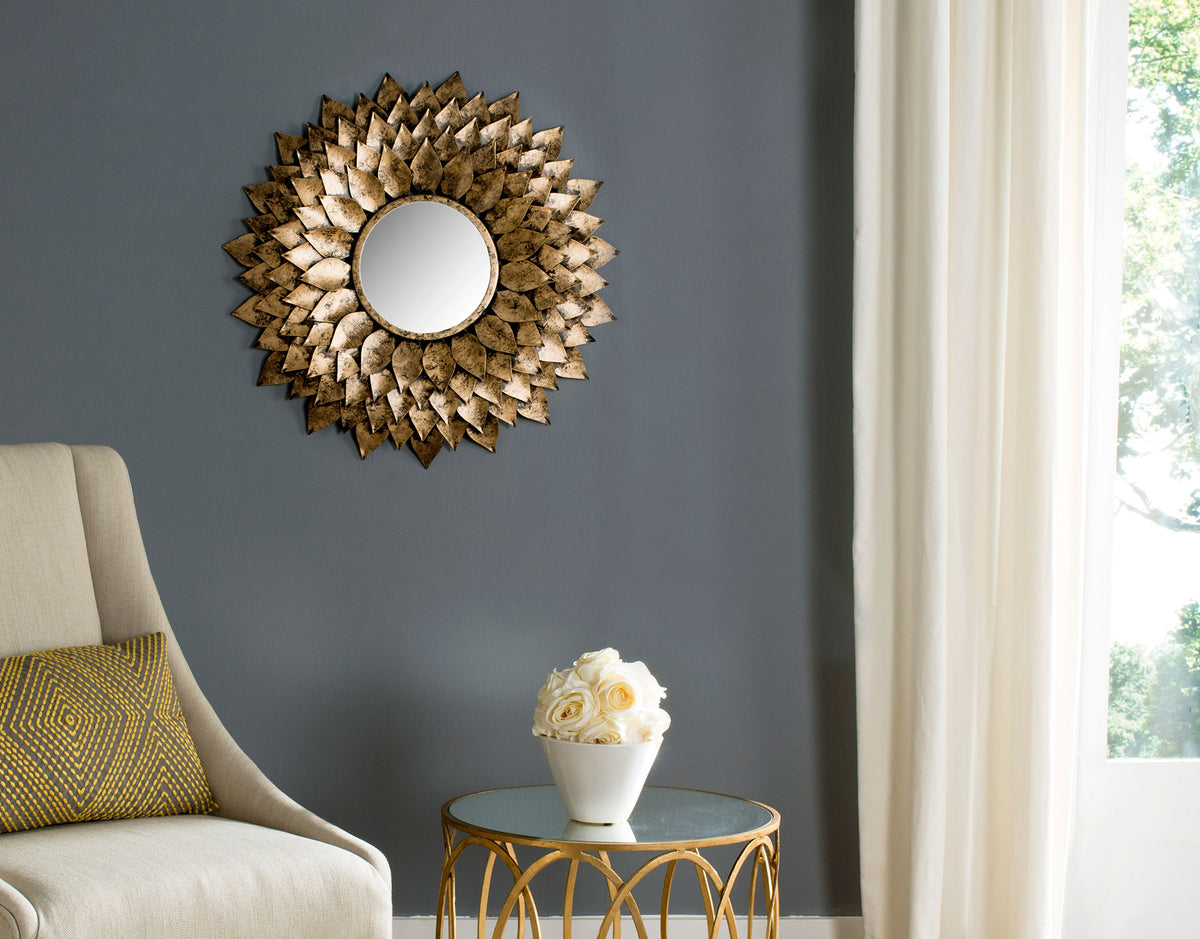 A textured gold sunburst mirror creates a warm focal point on a charcoal living room wall. || MIR4041A || front_room