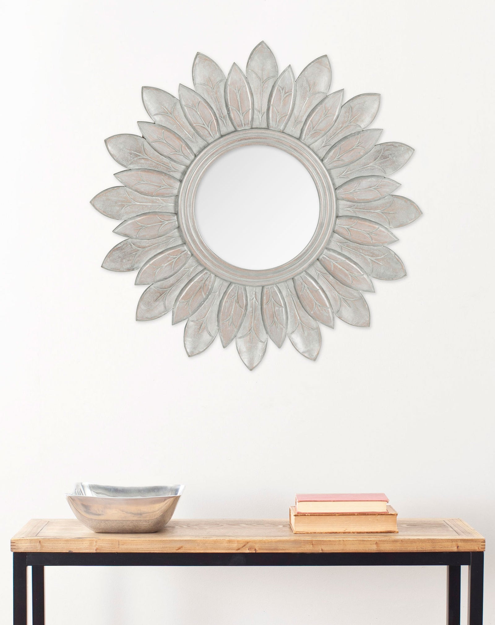 A gray sunburst mirror adds a softly weathered focal point above a wood console || MIR5003A || front_room