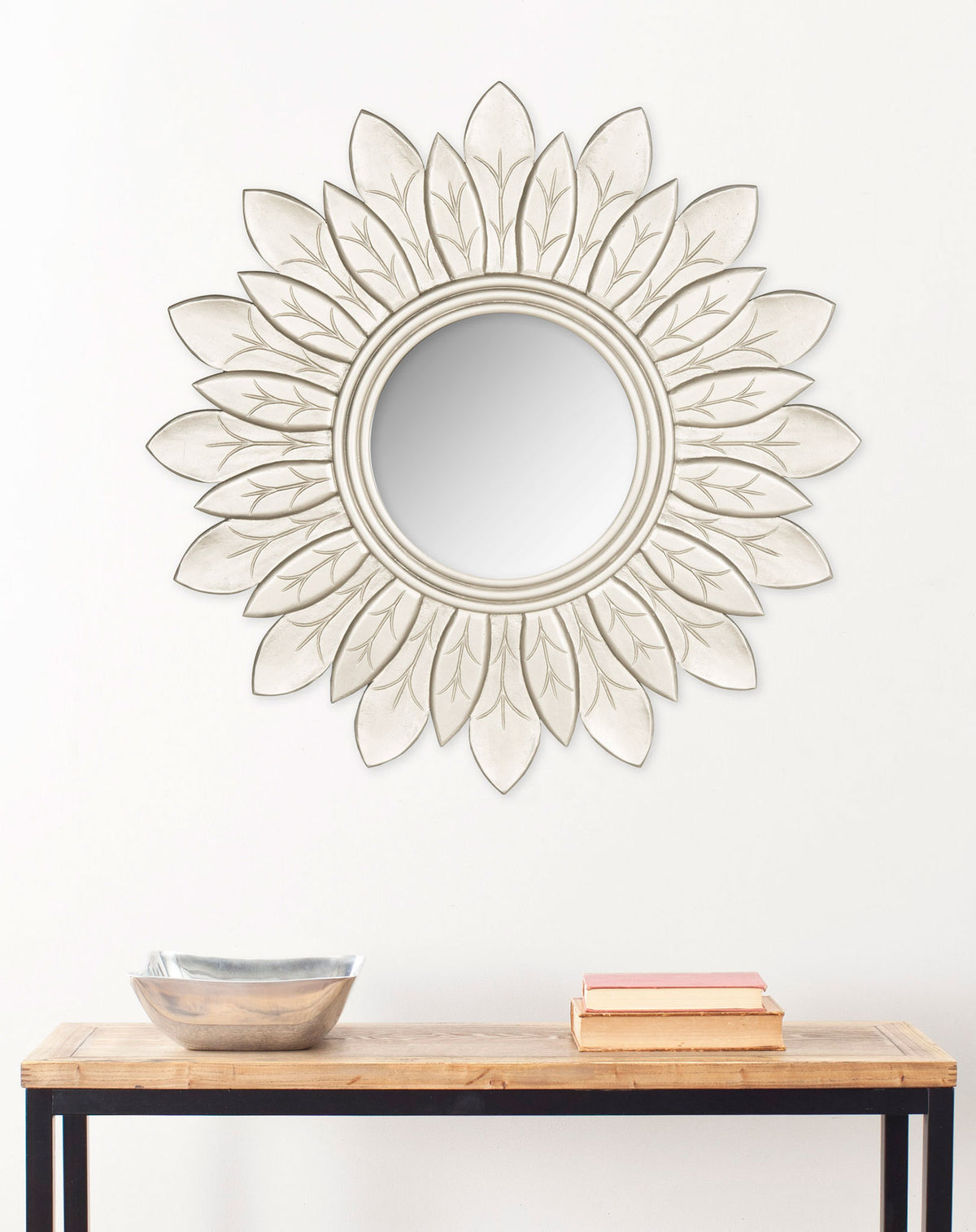 A pewter sunburst mirror creates a classic focal point above a simple console || MIR5003B || front_room