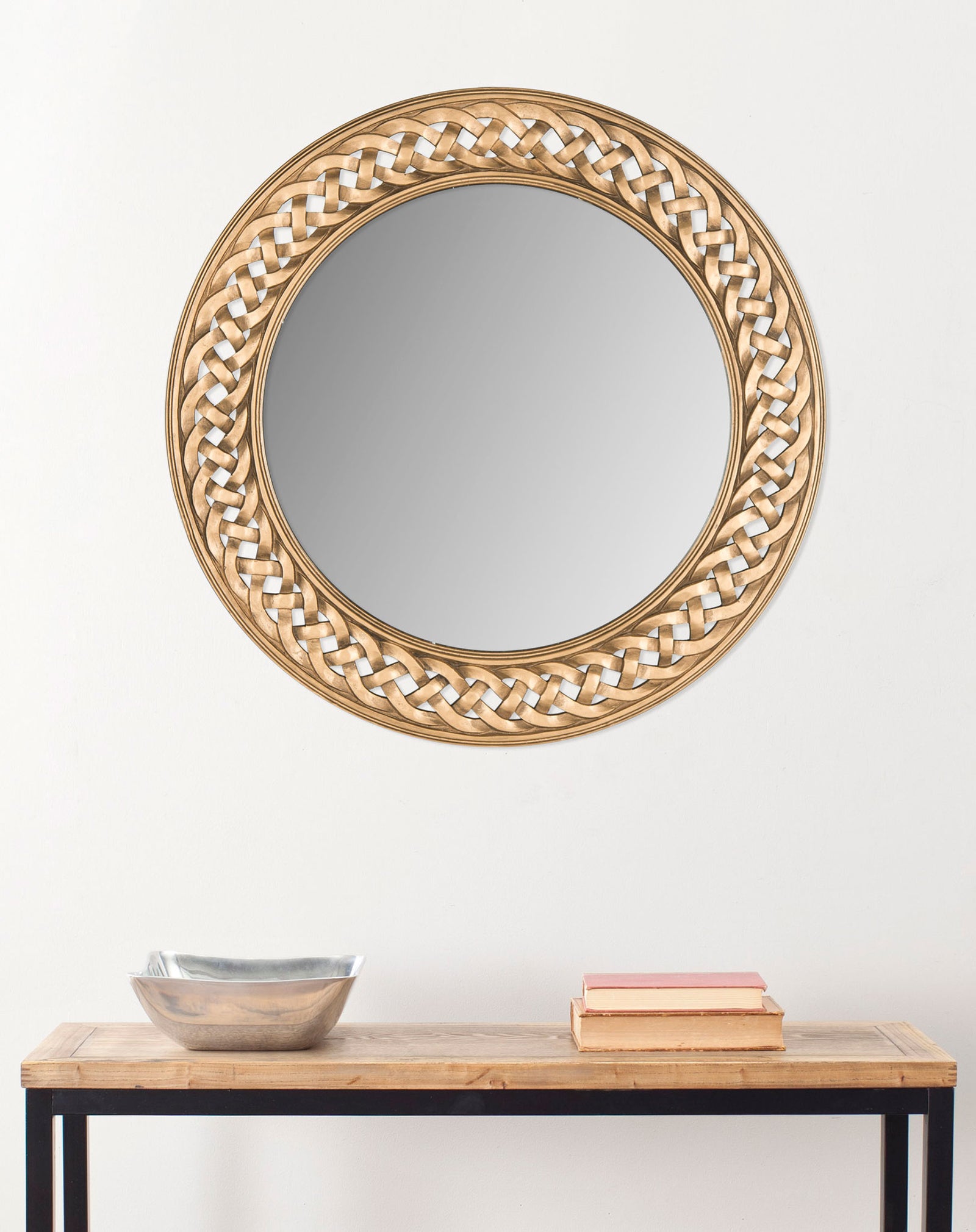 A round gold mirror brings an elegant focal point to the wall above a console table || MIR5005C || front_room