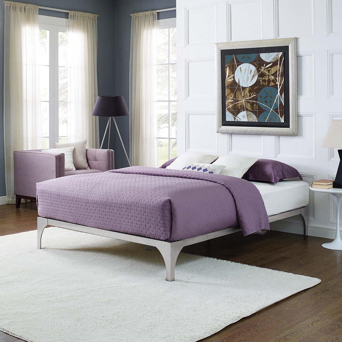 Streamlined silver bed frame adds modern polish with arched legs and open floor space