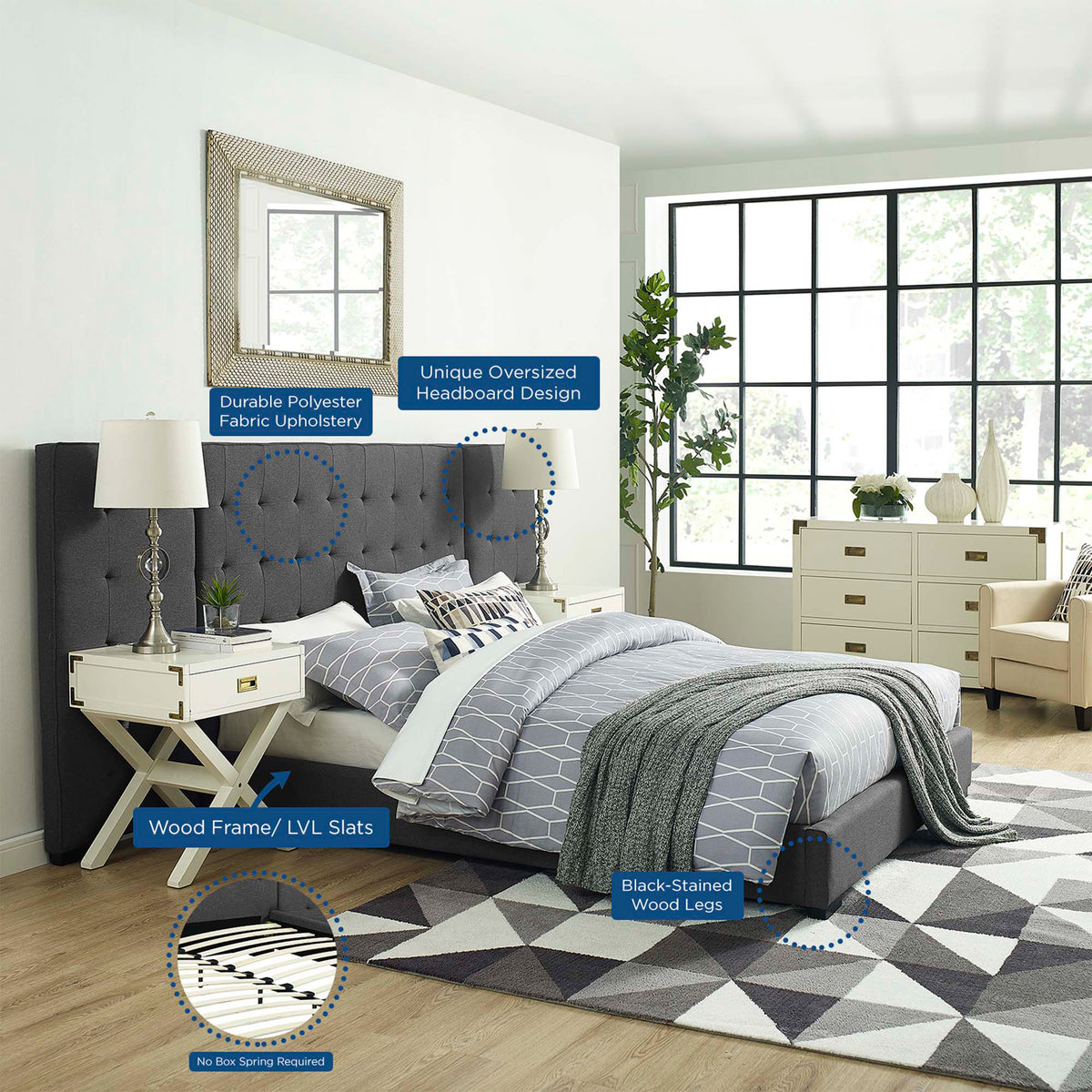 Polyester upholstery, wood slats and black-stained legs complete the gray tufted bed.
