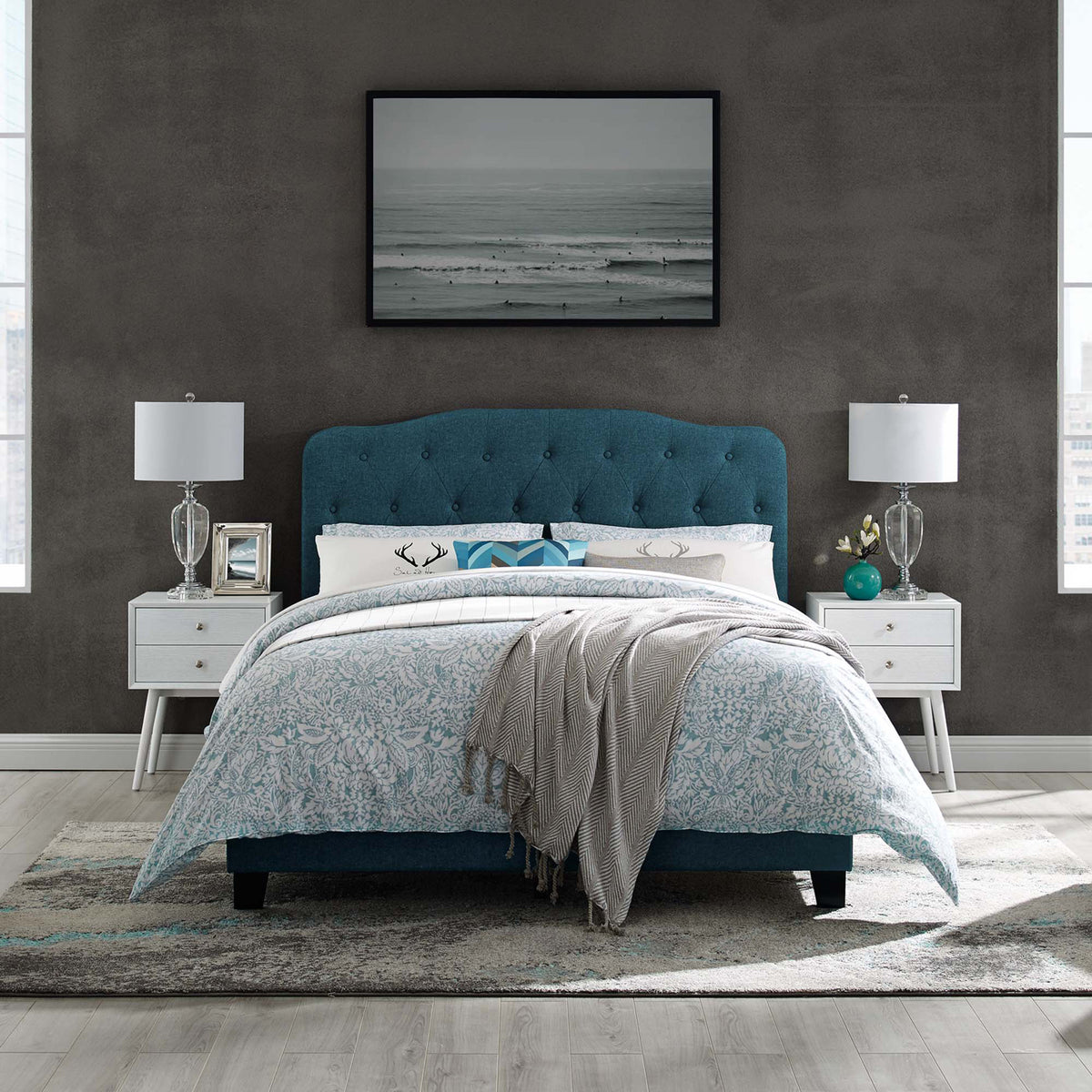 Azure button-tufted bed brings rich color and cozy comfort to a modern bedroom