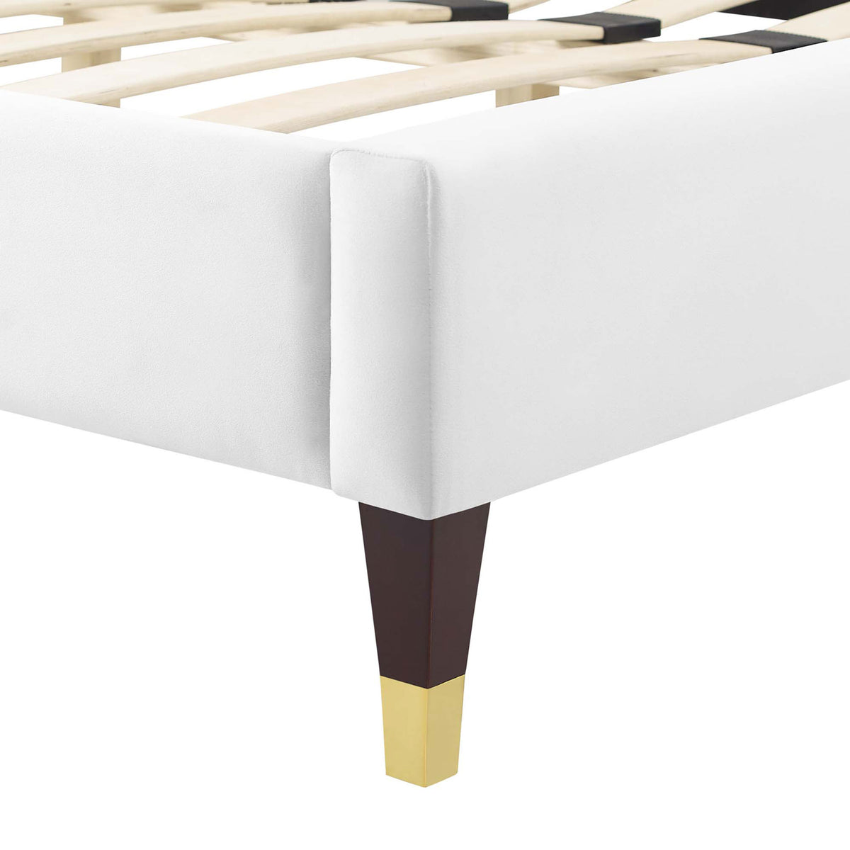 Gold-capped tapered leg and smooth velvet upholstery at the corner. || MOD-6596-WHI || leg_studio