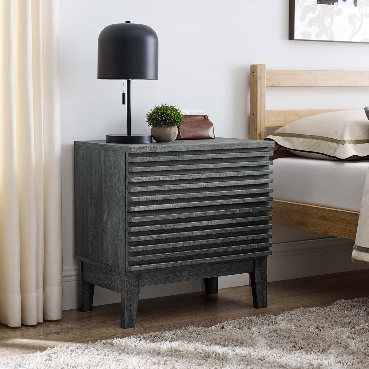 Charcoal nightstand beside a bed styled with lamp and decor on the smooth top surface || MOD-6964-CHA || front_angle_room