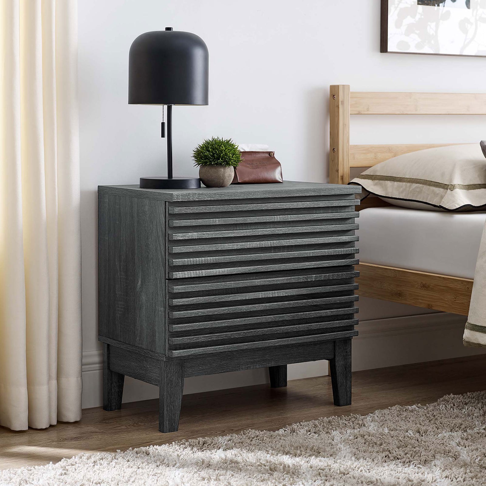 Charcoal nightstand beside a bed styled with lamp and decor on the smooth top surface || MOD-6964-CHA || front_angle_room
