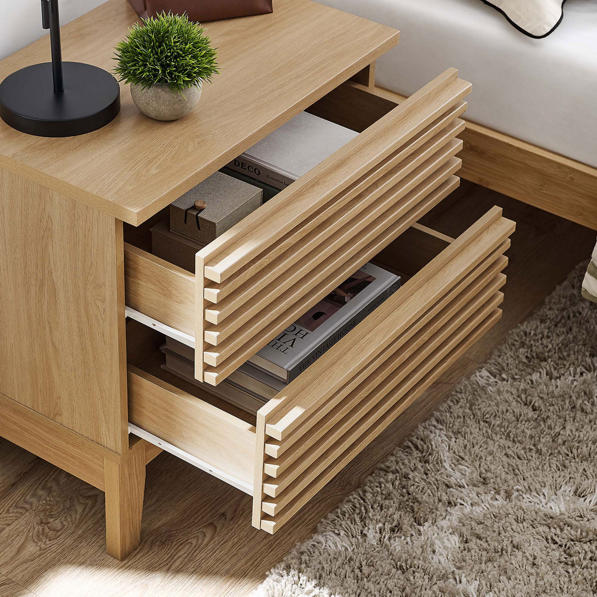 Render oak nightstand styled bedside with both drawers open to reveal organized storage for books and essentials || MOD-6964-OAK || storage_open_room