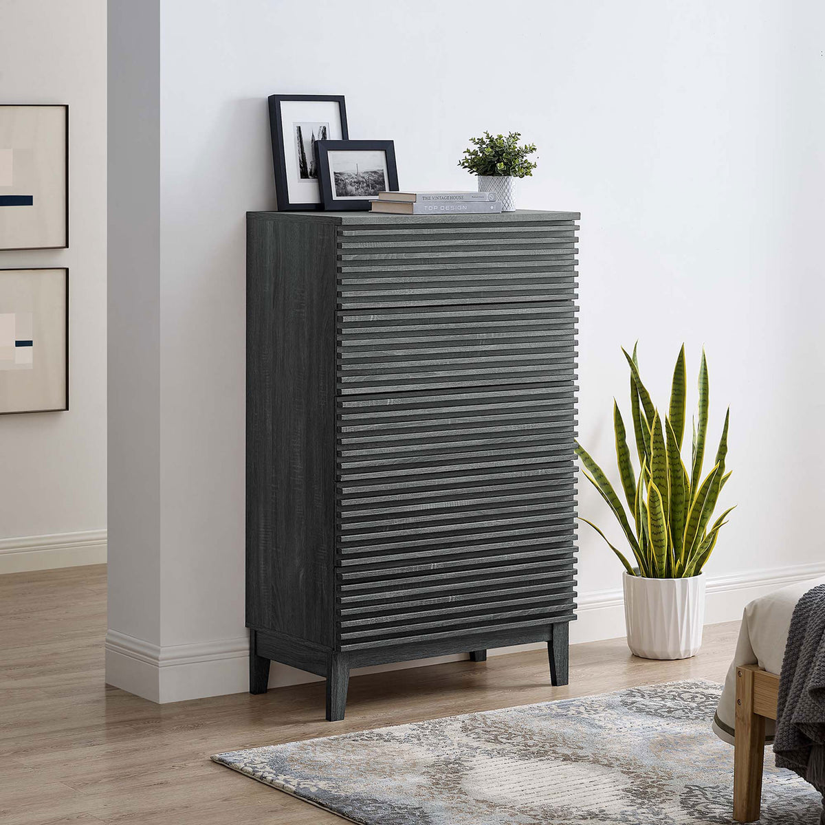 Charcoal 5-drawer dresser chest styled in a modern bedroom, adding vertical storage and subtle mid-century texture. || MOD-6967-CHA || front_angle_room
