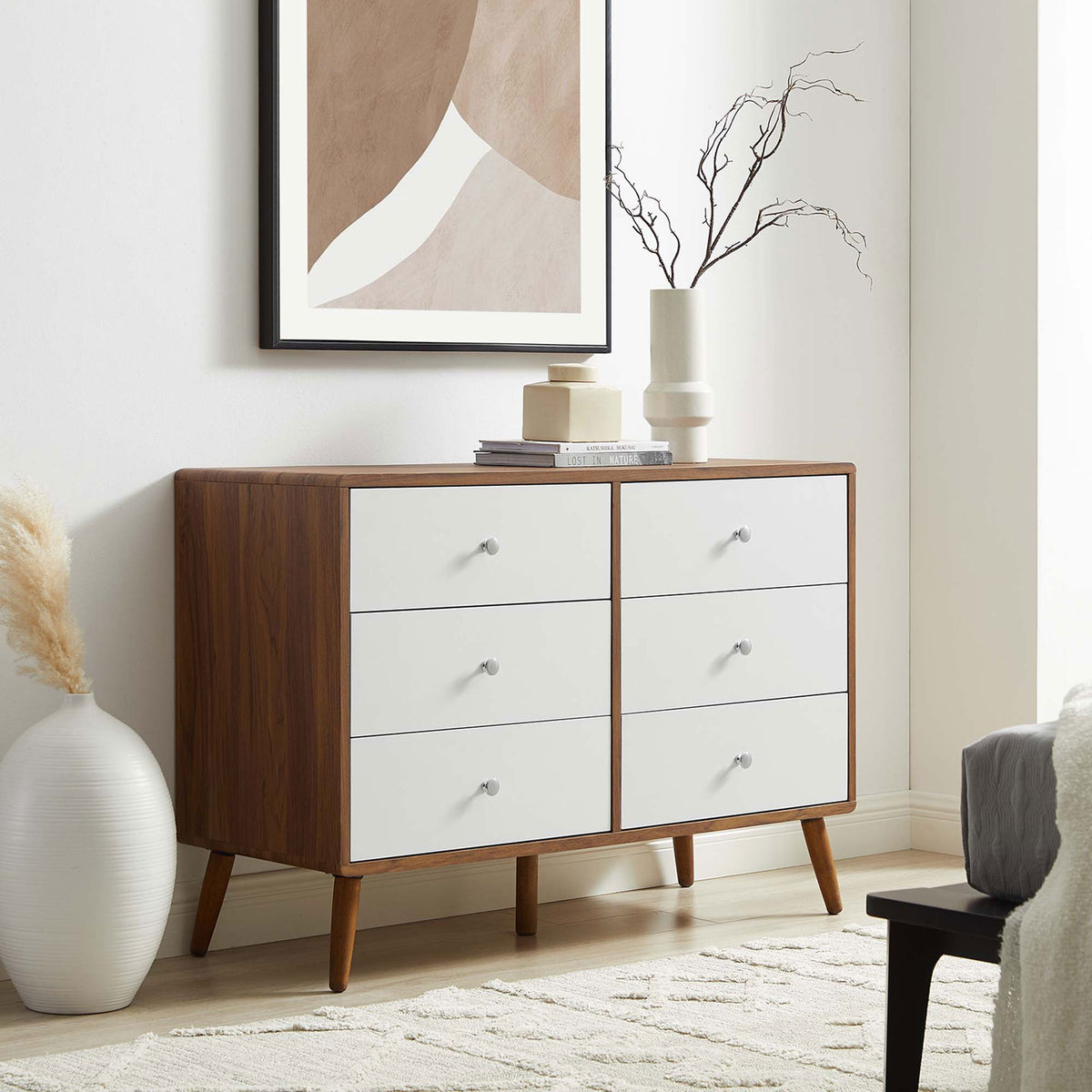 Six-drawer walnut and white dresser styled in a bright bedroom with modern neutral decor. || MOD-7021-WAL-WHI || front_angle_room