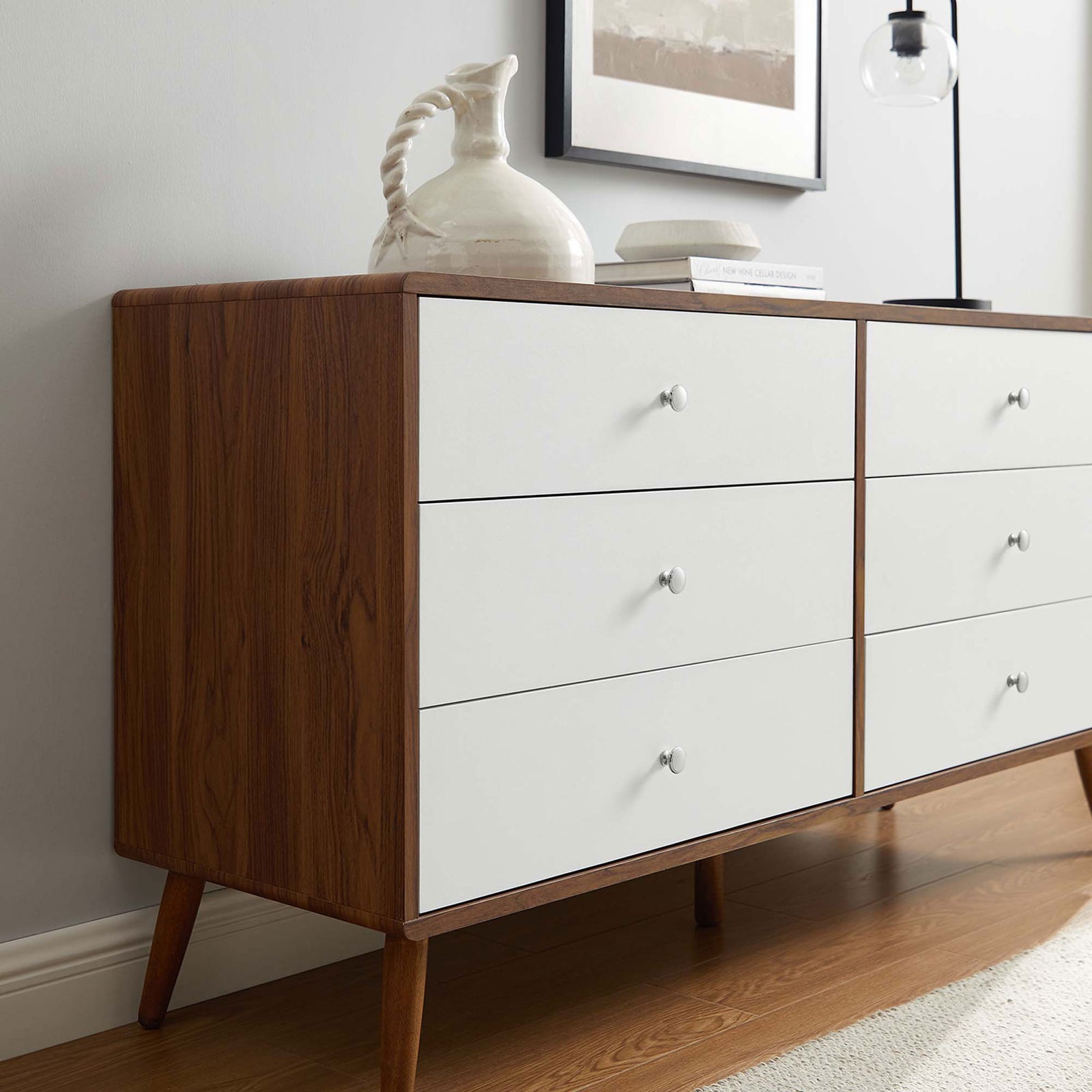 Walnut and white dresser surface styled with a sculptural pitcher and decor on warm wood flooring. || MOD-7022-WAL-WHI || detail_room